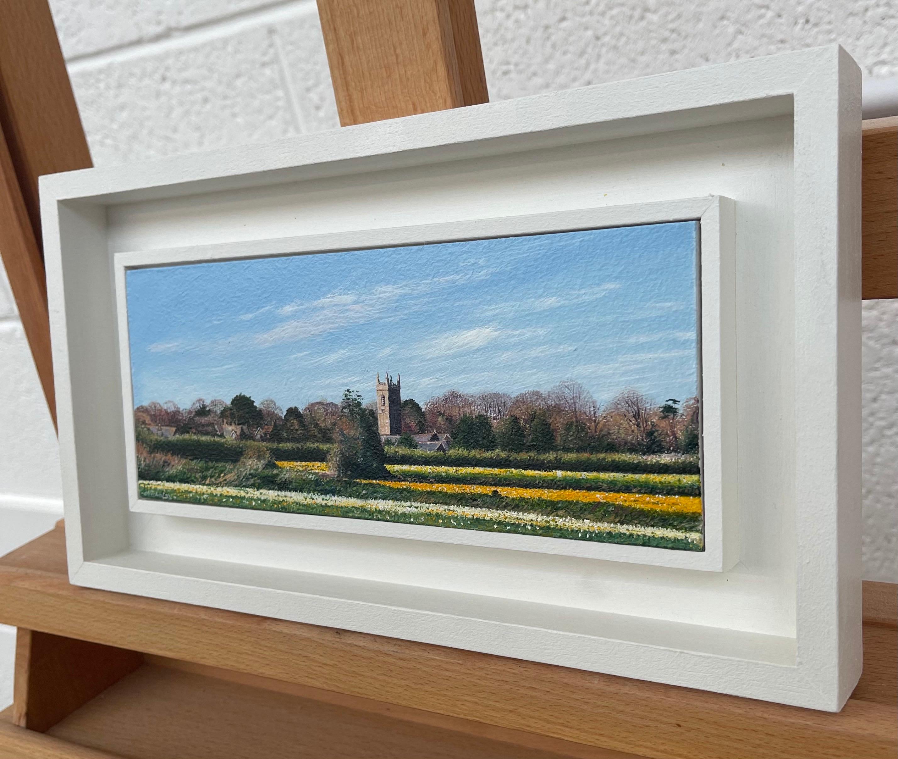 Daffodil Fields English Landscape Painting by Contemporary Photorealist Artist, Nicholas Smith. 

Art measures 8.5 x 3.5 inches
Frame measures 11.5 x 6.5 inches  

Born December 1960, the son of one of Britain’s foremost landscape artists, Caesar