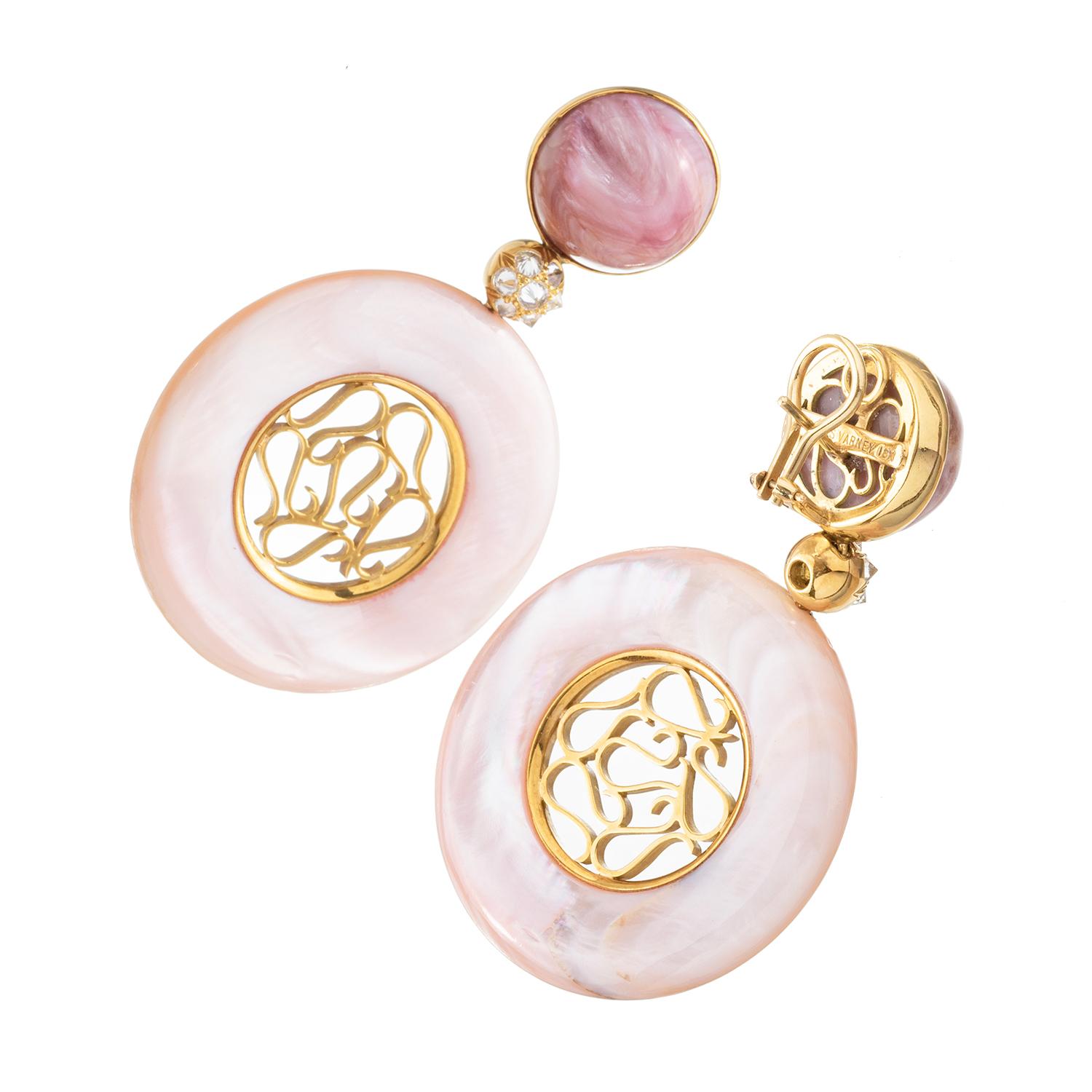 These Nicholas Varney long pendant earrings feature circular-shaped pink mother-of pearl drops each centering an openwork organic lattice design in 18k yellow gold.  The drops are suspended from round cabochon rose quartz tops with natural parting