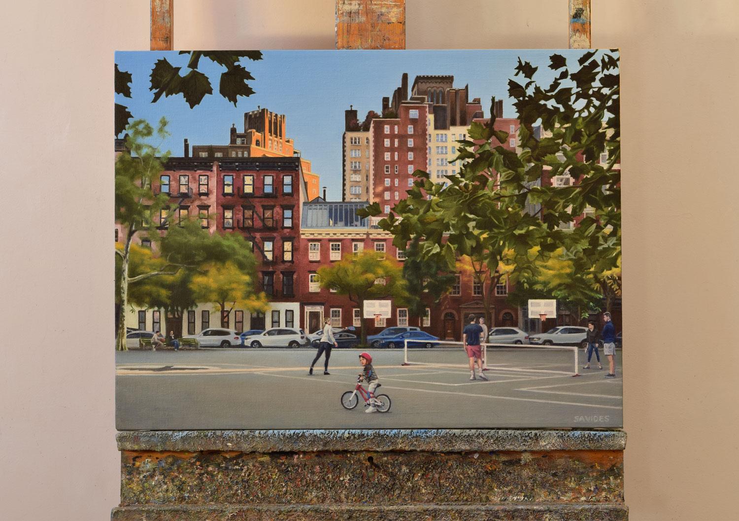<p>Artist Comments<br>Artist Nick Savides shows the Seravalli Playground on Gansevoort, bathed in the warm glow of late afternoon sunlight. The orange hues of the one building contrast against the clear blue sky. A group of people play pickleball