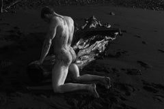 Untitled (Kneeling by Driftwood)