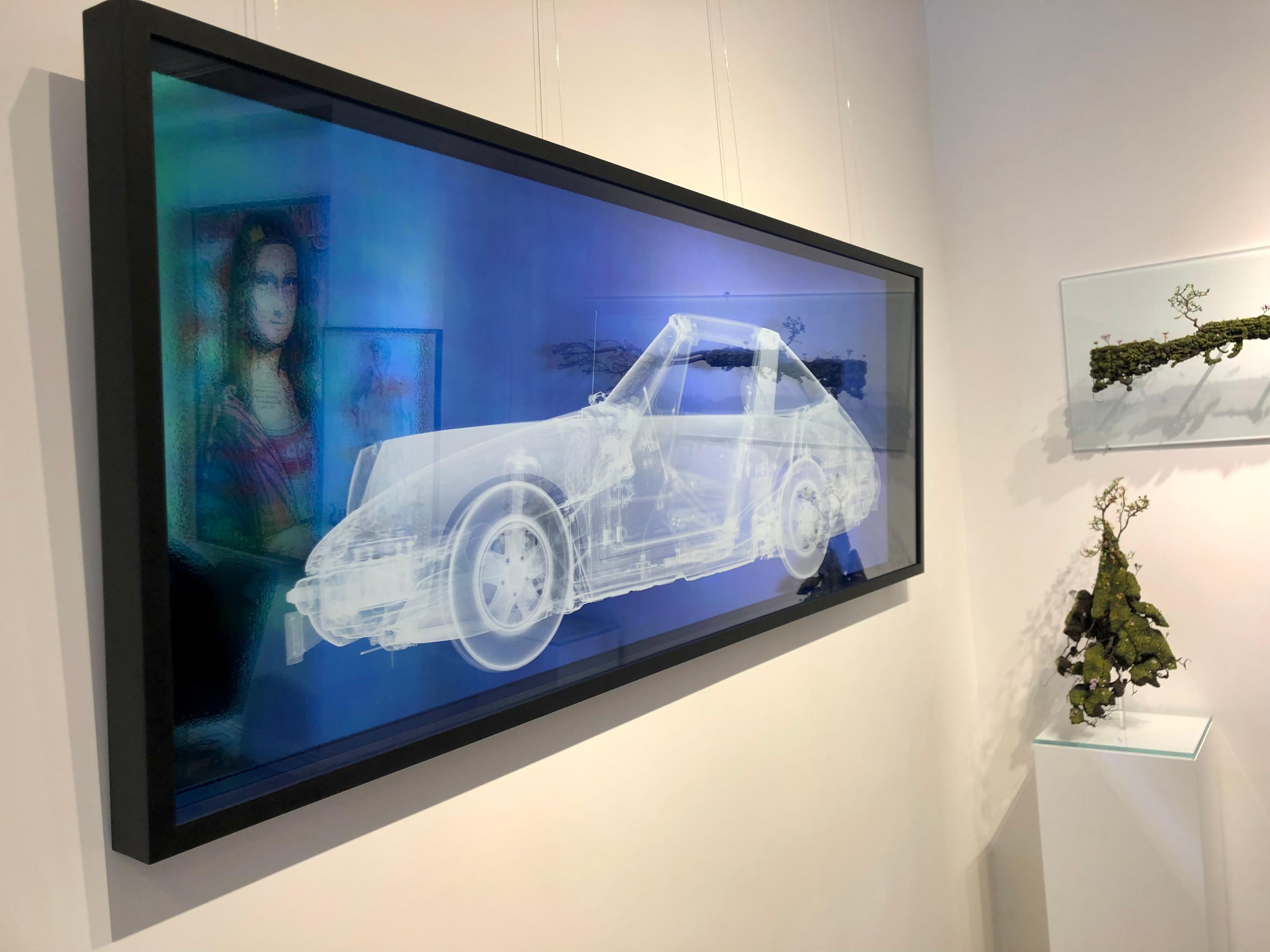 White Porsche (on teal and blue) - Contemporary Photograph by Nick Veasey
