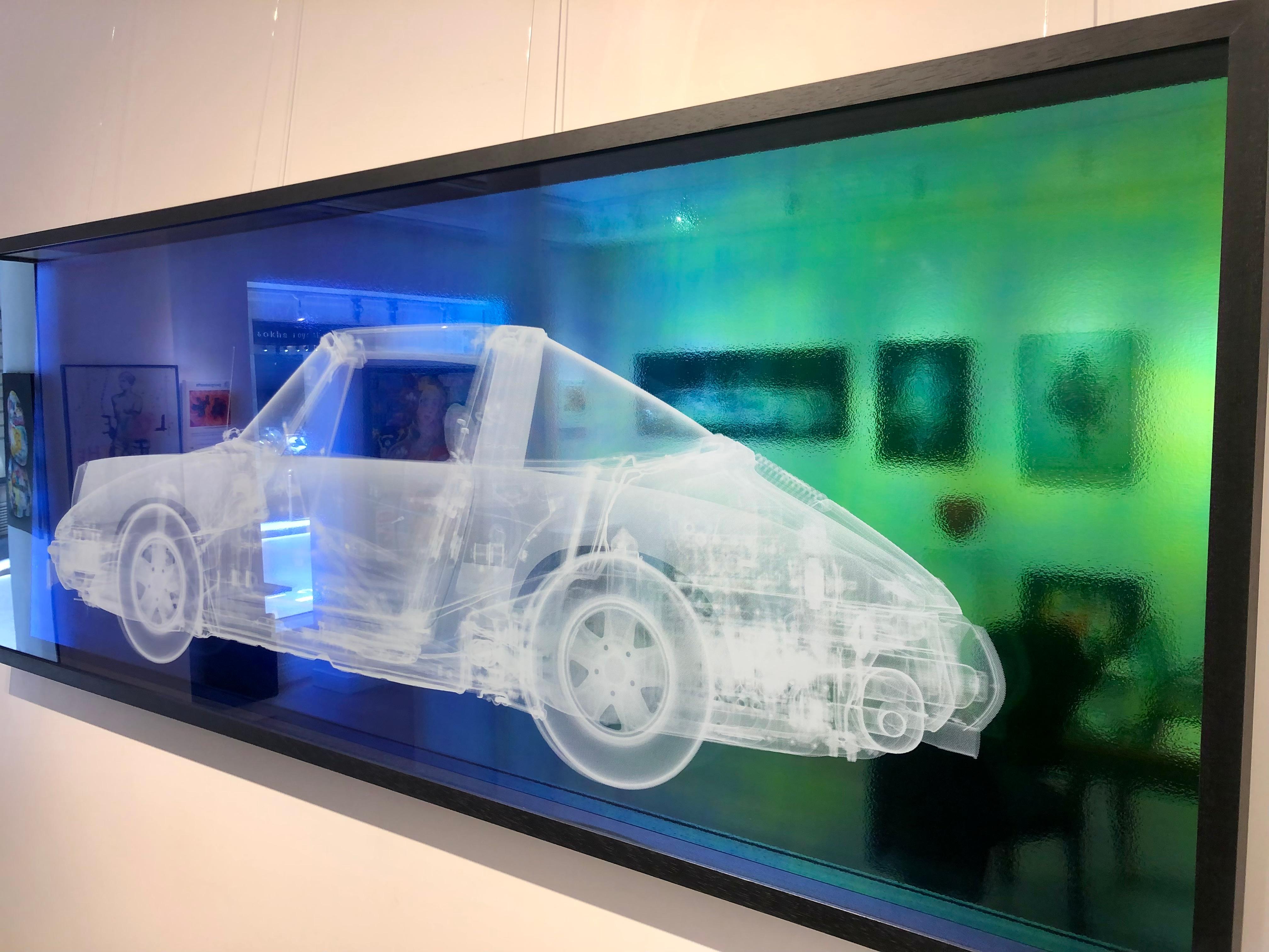 Porsche Targa in teal blue and green.
From specials collaction of contemporary British artist Nick Veasey.
X-Ray print onto textured metallic vinyl in black frame 
Limited Edition of 15 
