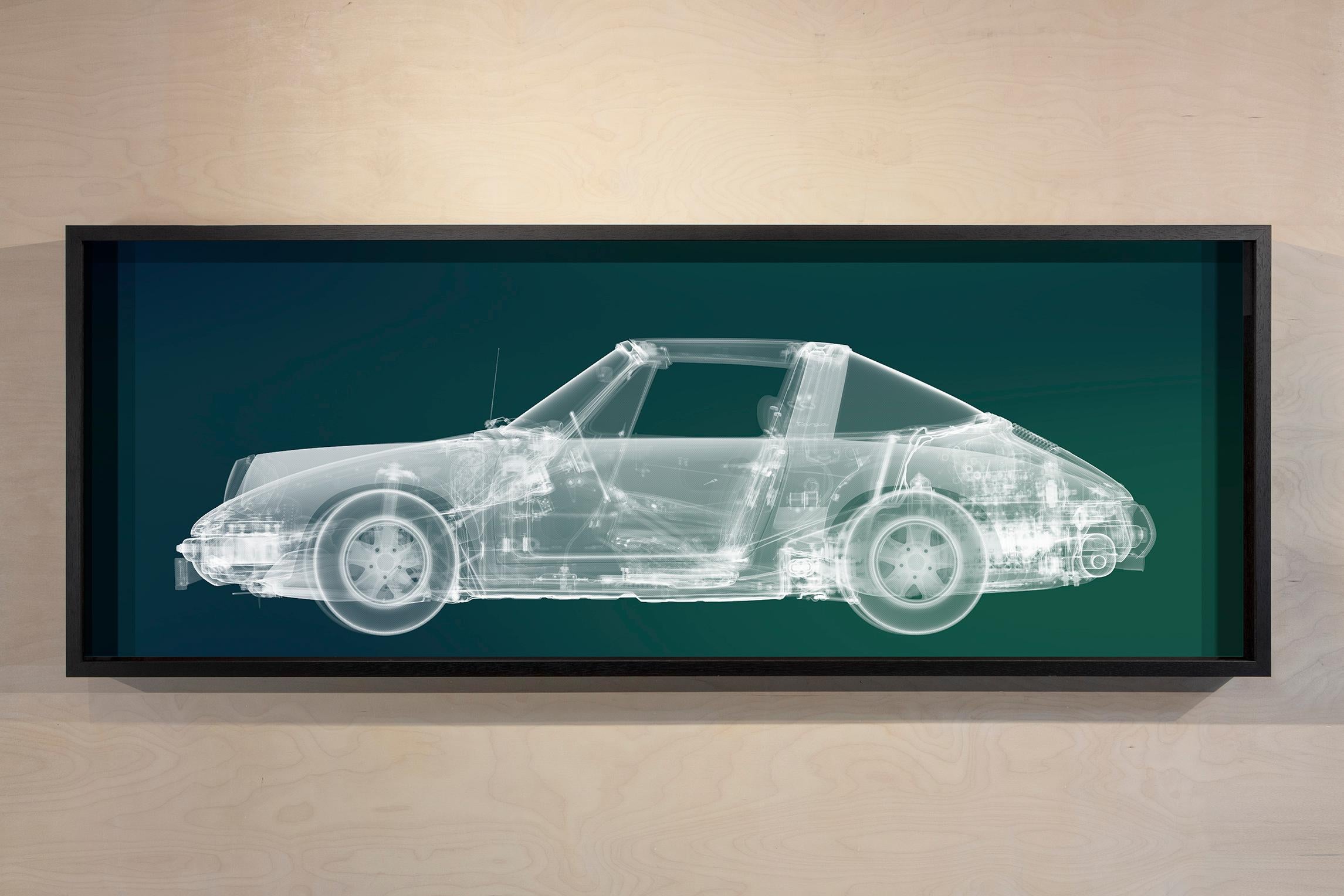 Nick Veasey Figurative Photograph - White Porsche (on teal and blue)