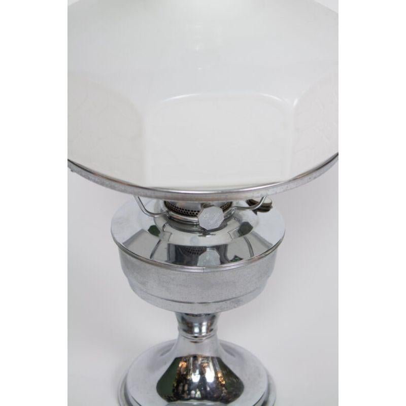 Alladin nickel oil lamp. For use with oil. Octagonal white glass shade, by Alladin. With original chimney and chimney cover.

Material: nickel, glass
Style: Victorian,Cottage
Place of origin: United States
Period made: mid-20th century
Maker: