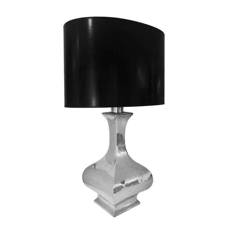 Nickel baluster table lamp with black oval shade, France, 1960s. 

Measures: Body 8