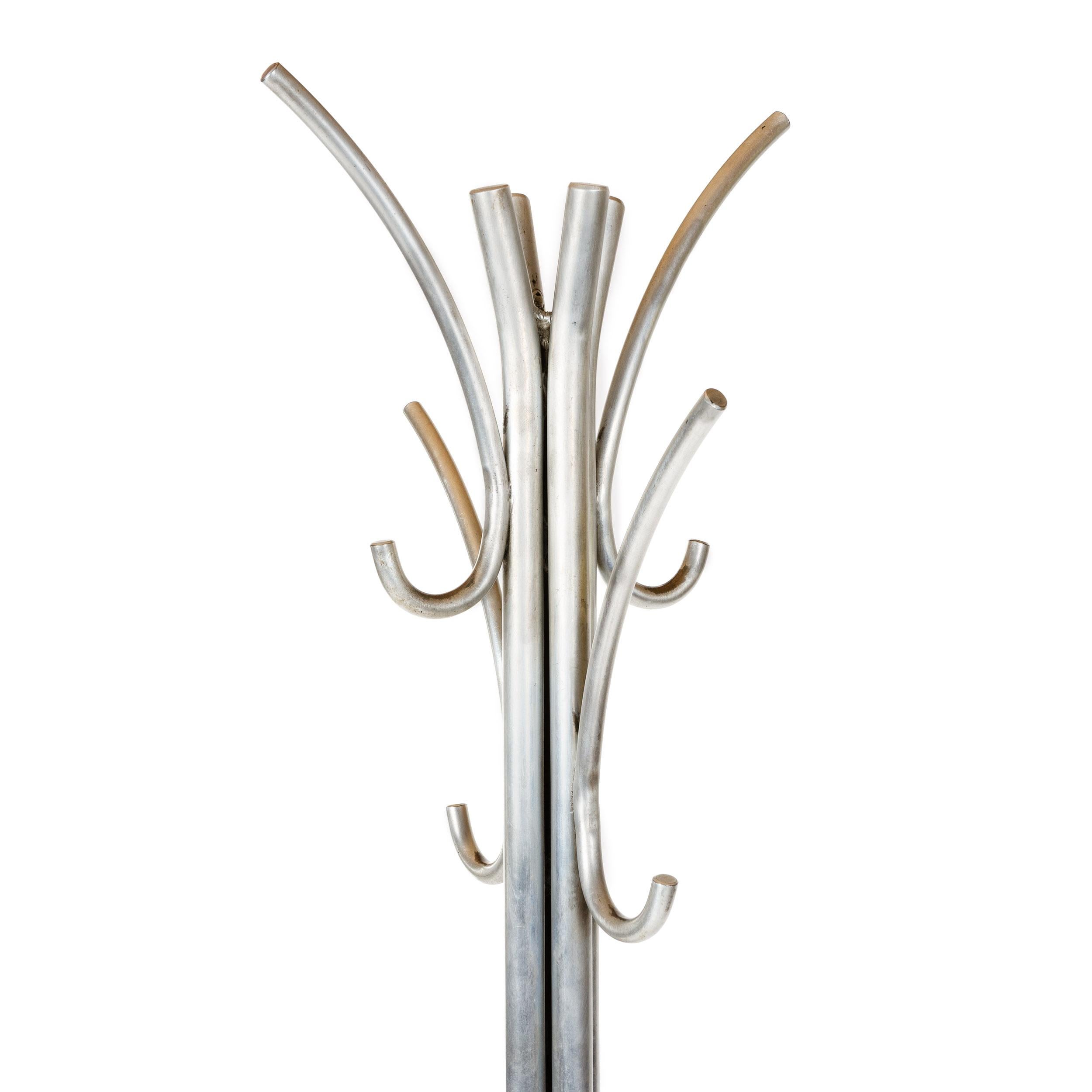 A simple and sublime coat tree with four (4) double hooks, retaining the original nickel finish.