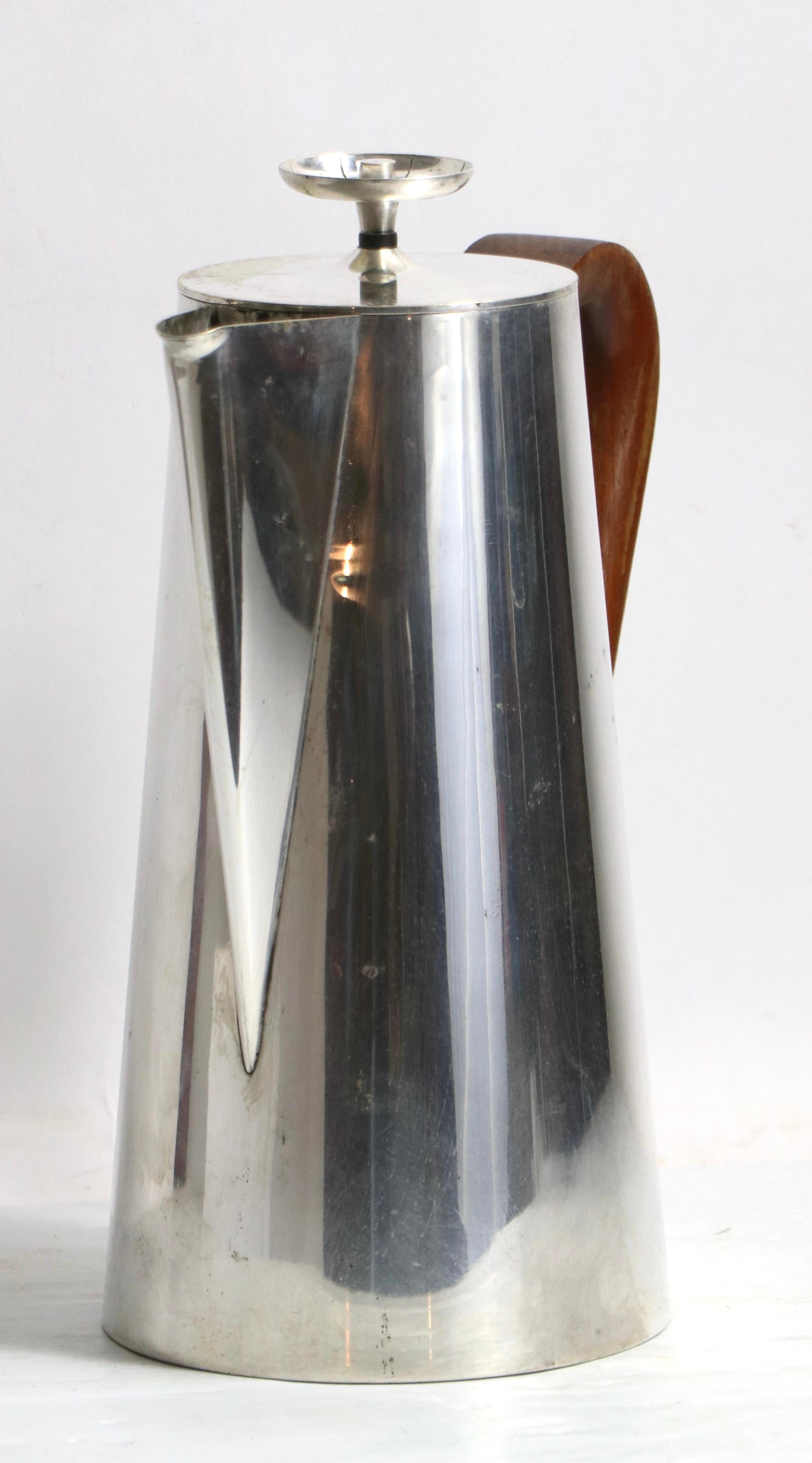 Classic Parzinger design nickel plated coffee pot, with sculpted solid walnut handle. This example is in overall good condition, the top shows some loss of plating, please see images.