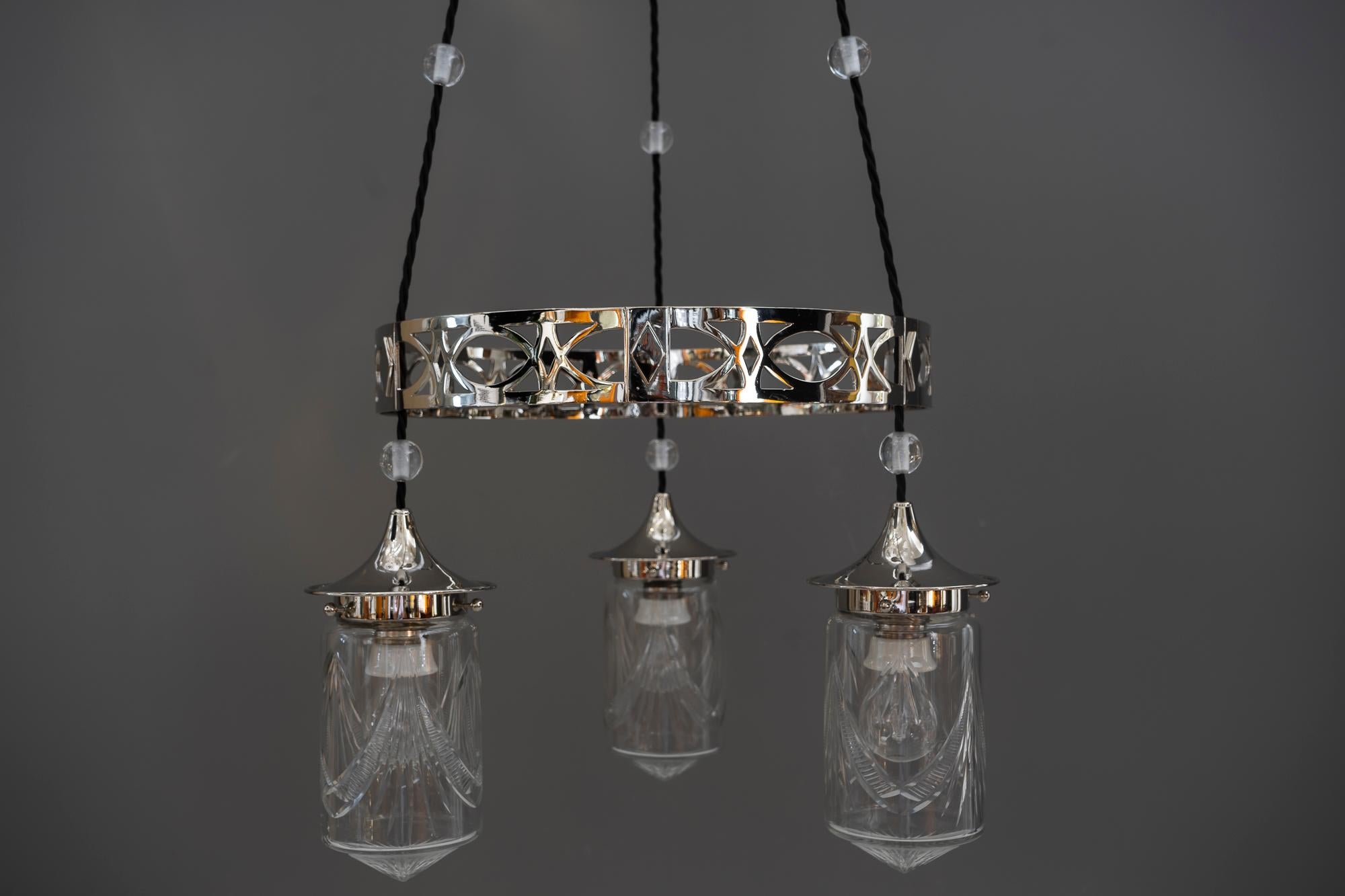 Nickel-plated Art Deco chandelier with original cut-glasses, circa 1920s.
  