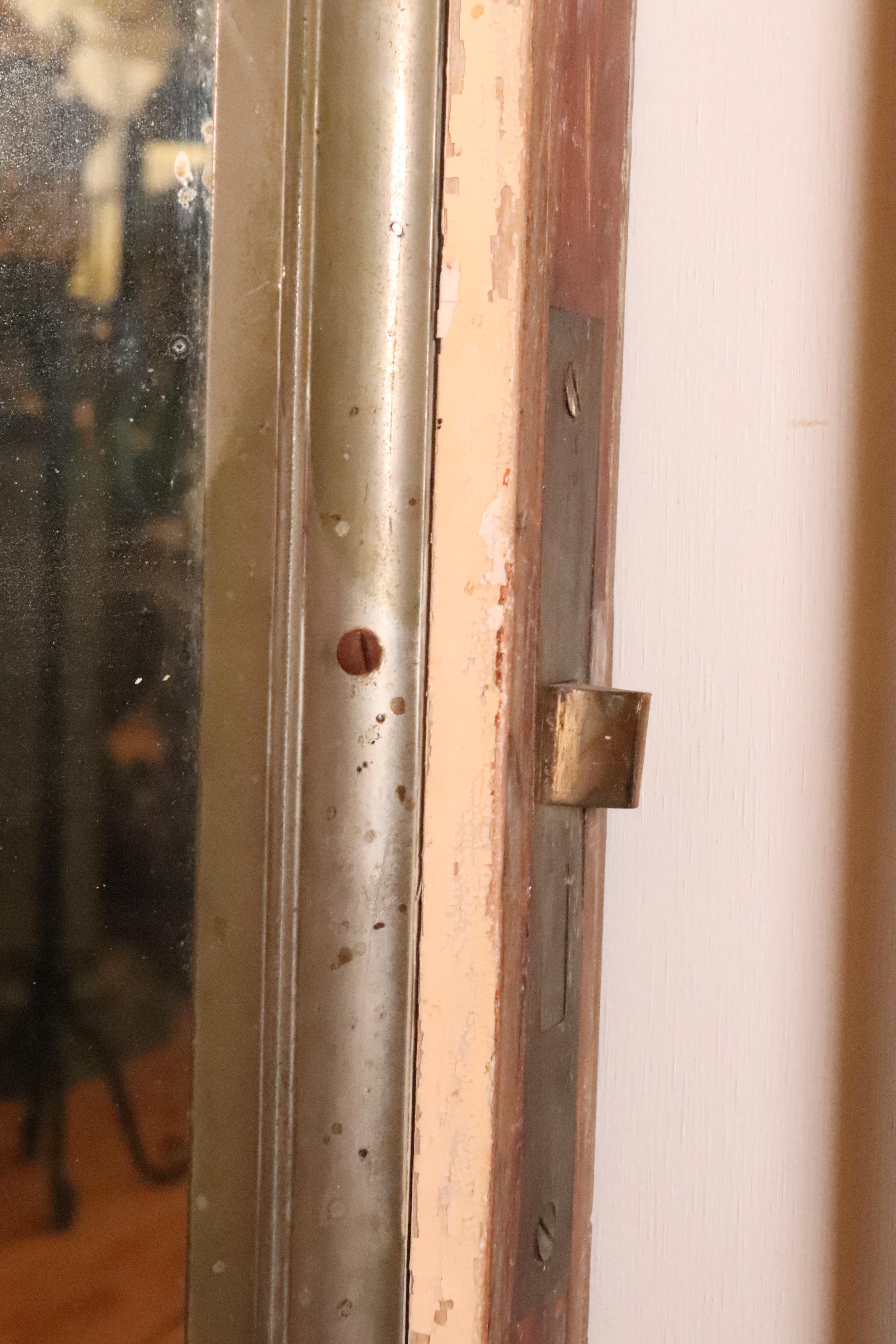 Nickel Plated Brass Mirror Mounted on Cream Door For Sale 5