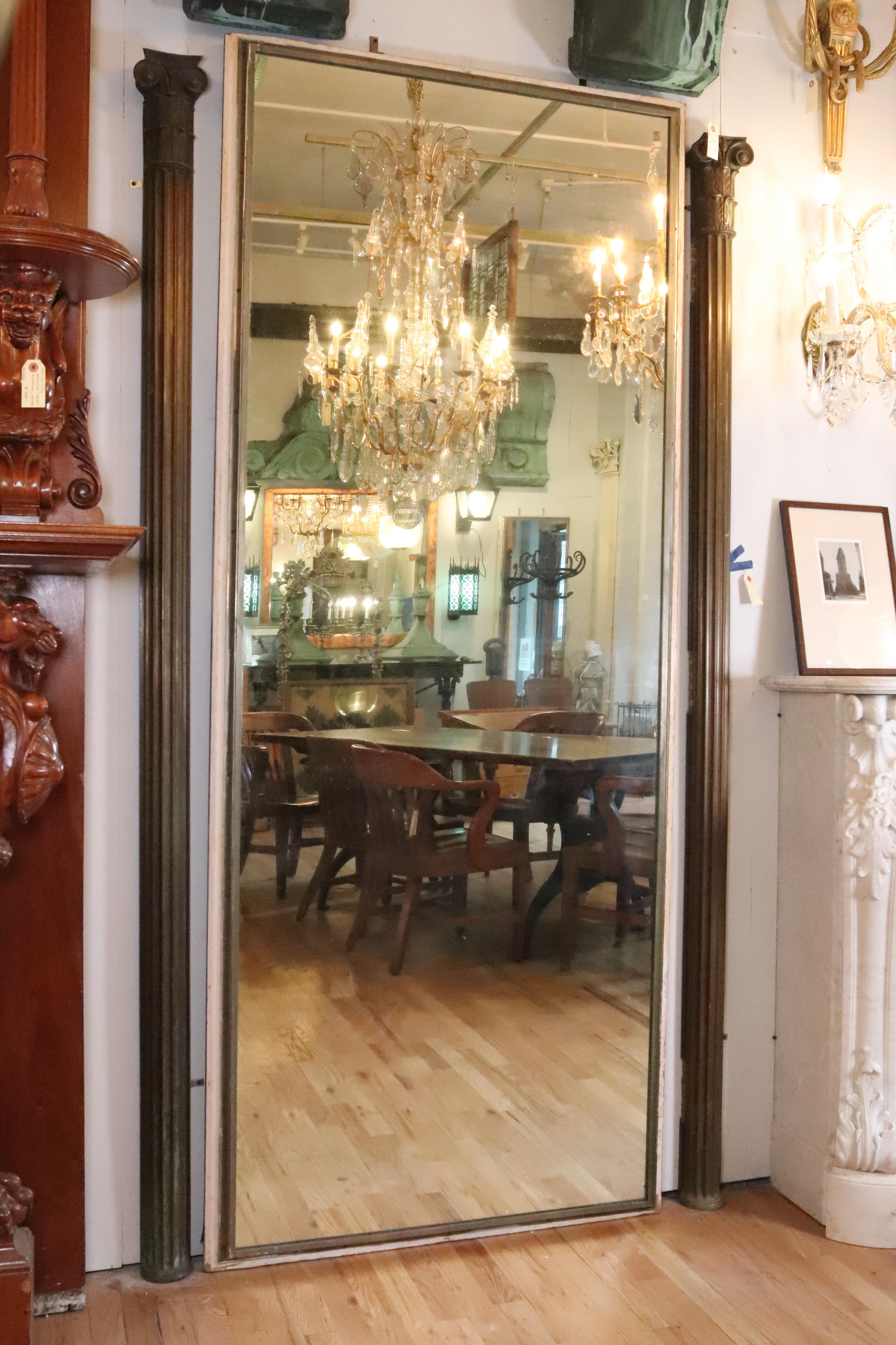Lightly distressed silvered by hand. The center section is from an old tri-fold mirror now mounted to a cream colored painted wood door. Good condition, with some minor chipping cream paint. Please note, this item is located in our NYC location.