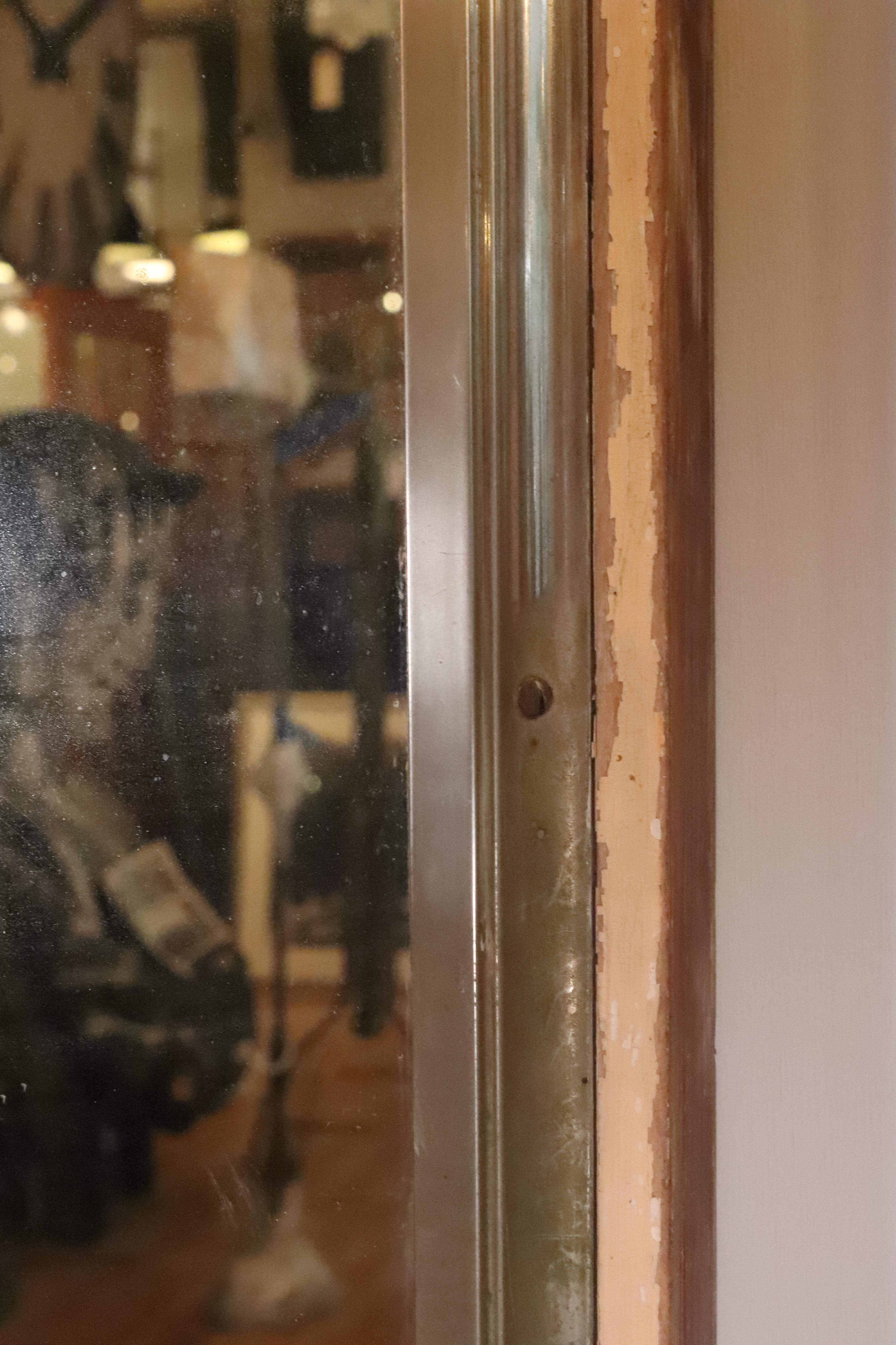 Nickel Plated Brass Mirror Mounted on Cream Door In Good Condition For Sale In New York, NY