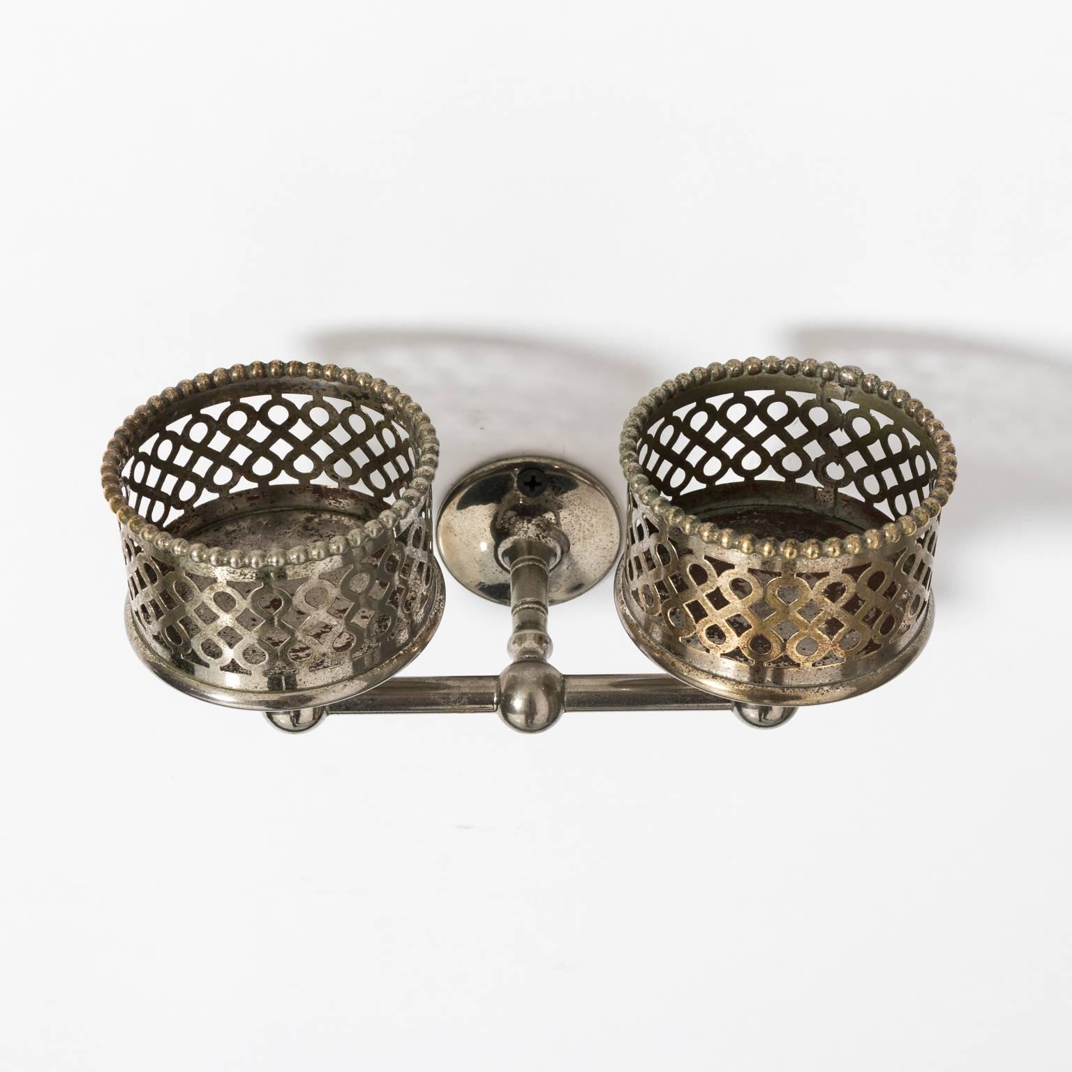 Reticulated and beaded double cup holder in an original, nickel-plated finish, circa 1900.
      