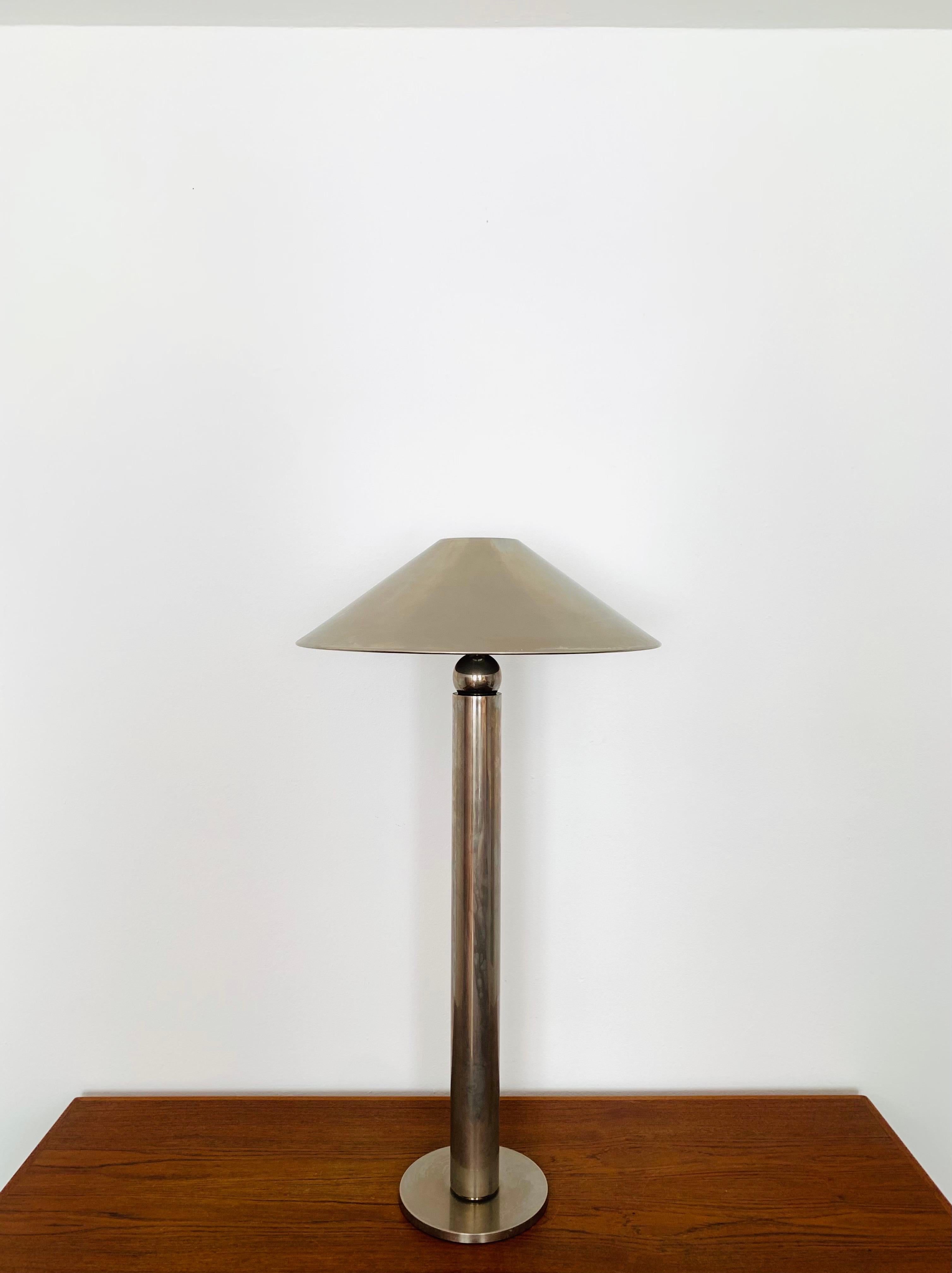 Very beautiful and rare nickel plated floor lamp from the 1970s.
The lighting effect of the lamp is extremely beautiful.
The design and the very beautiful details create a very noble and pleasant light.
The lamp creates a very cozy atmosphere and is