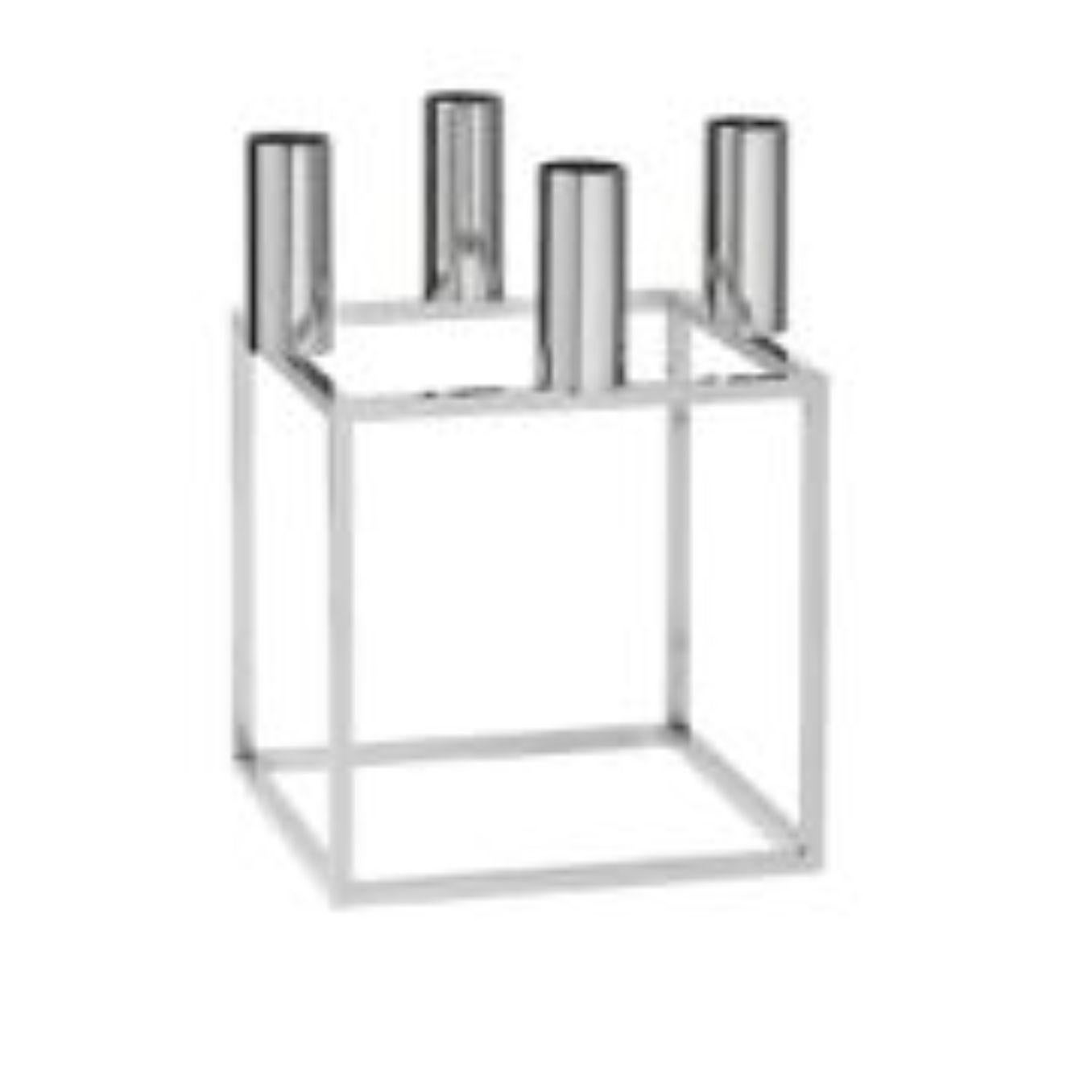 Nickel plated kubus 4 candle holder by Lassen
Dimensions: D 14 x W 14 x H 20 cm 
Materials: Metal 
Also available in different dimensions. 
Weight: 1.50 kg

A new small wonder has seen the light of day. Kubus Micro is a stylish, smaller