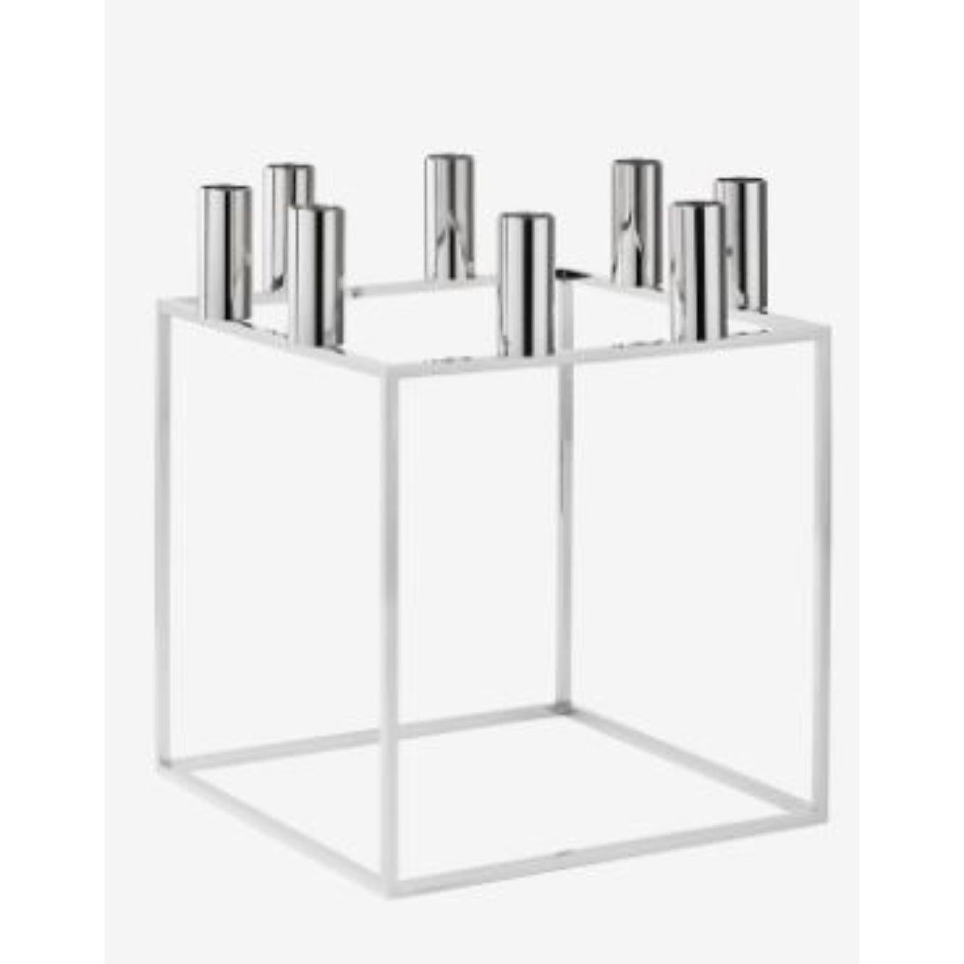 Nickel Plated Kubus 8 candle holder by Lassen
Dimensions: D 23 x W 23 x H 29 cm 
Materials: Metal 
Also available in different dimensions. 
Weight: 1.50 Kg

With a sharp sense of contemporary Functionalist style, Mogens Lassen designed the