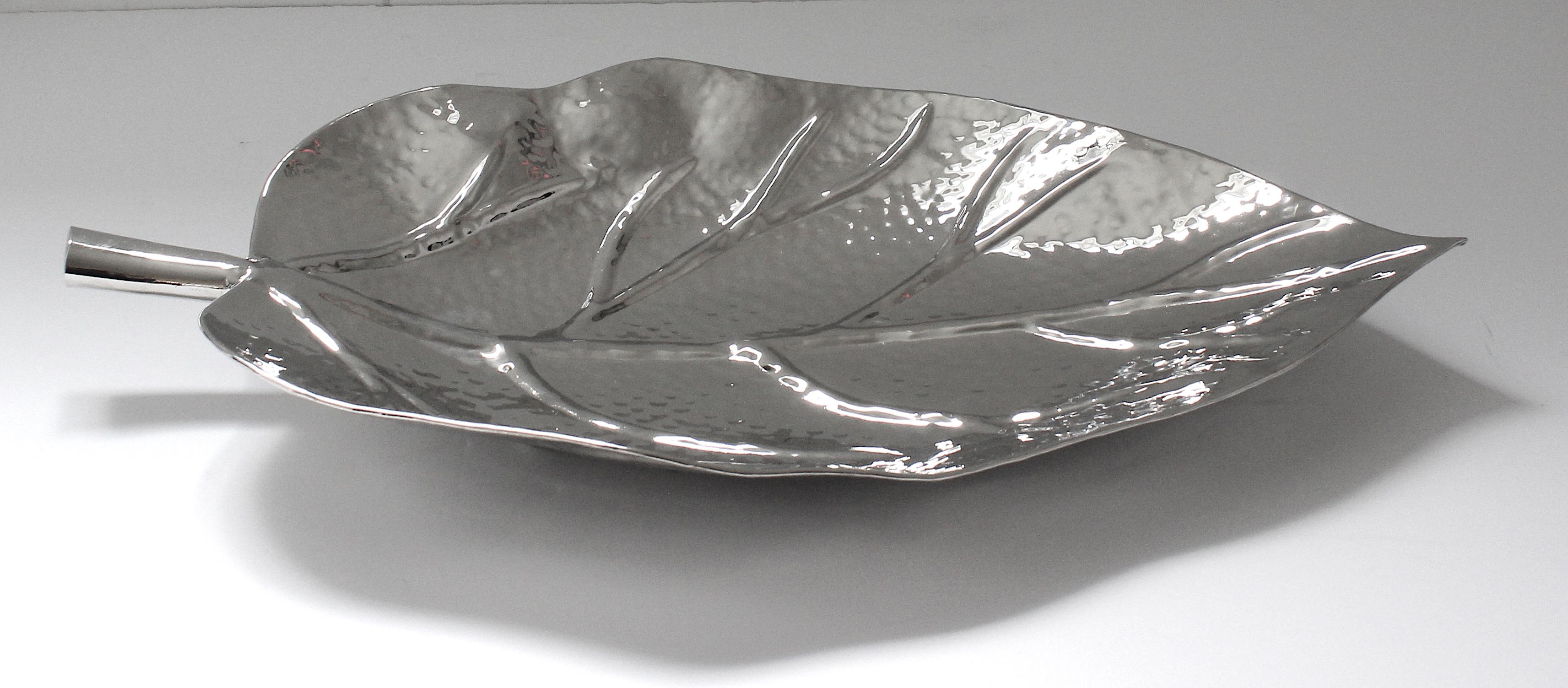 This stylish and chic nickel plated serving dish in the form of a leaf was created by Iconic Snob Galeries, and it will make a subtle statement with its form and finish.