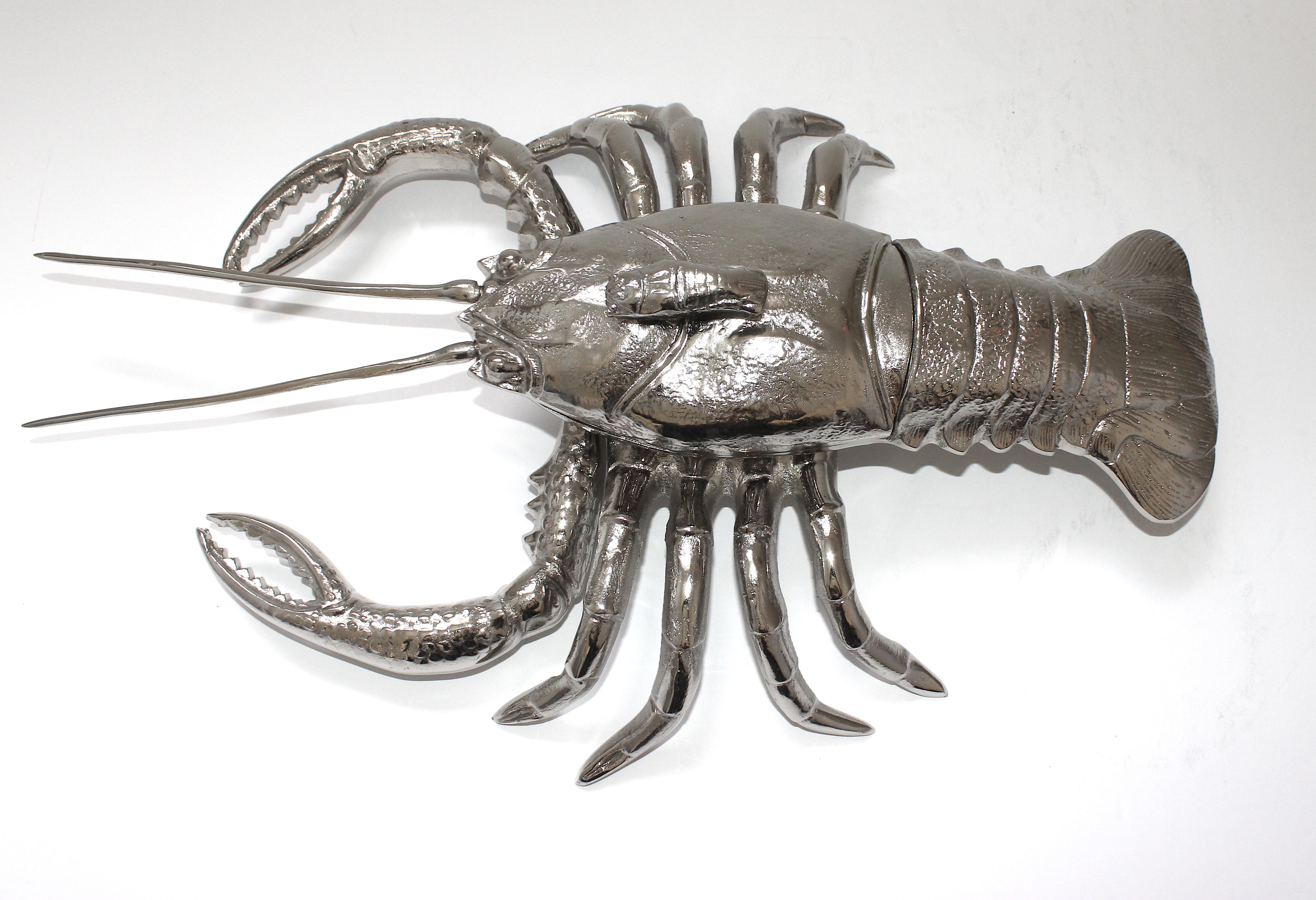 This large, life size figure of a lobster dates to the 1970s and has recently been nickel plated by Angel & Zevallos. The back of the lobster is removeable to use as storage or perhaps as a serving piece.

Note: We also have other sea creatures to