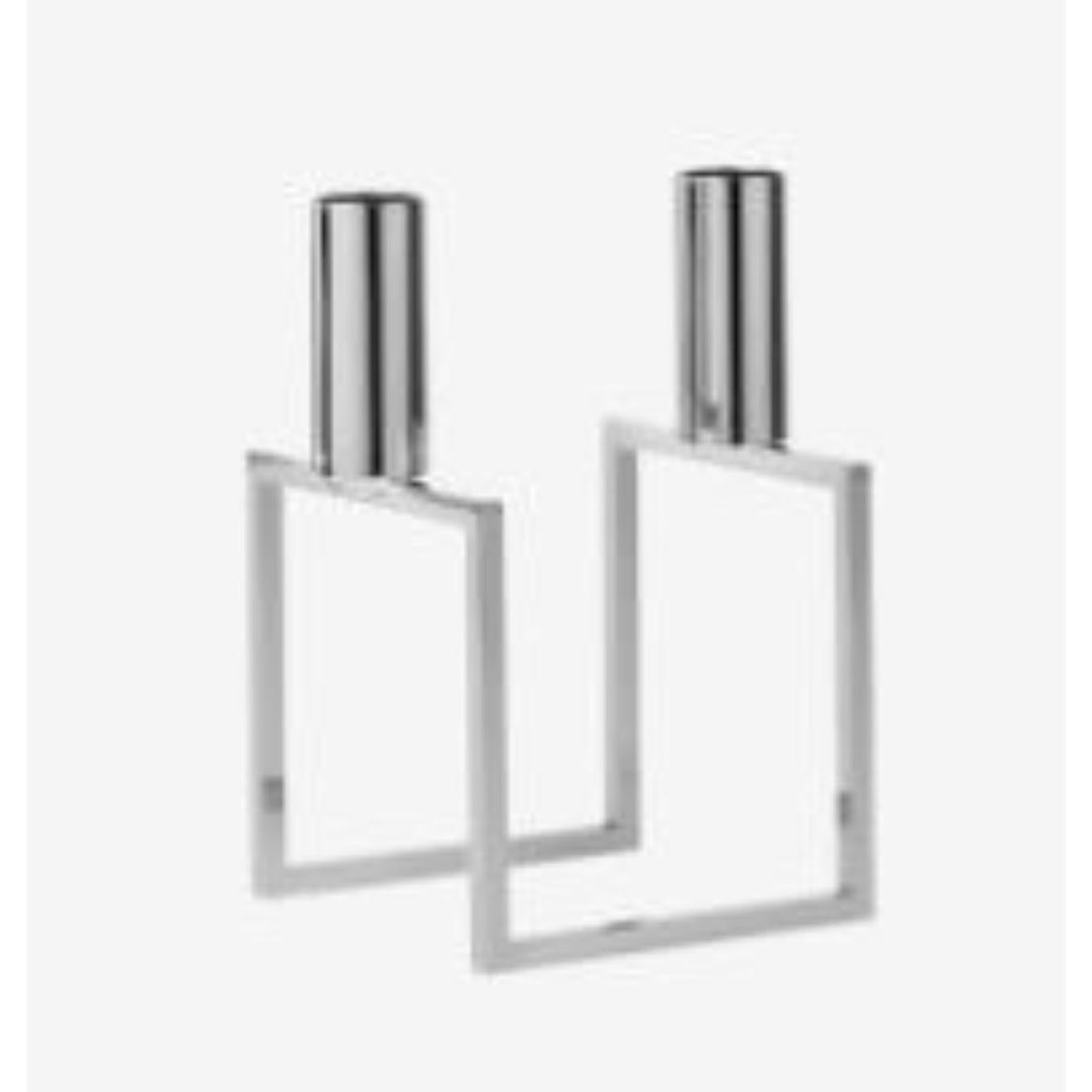 Nickel plated Line candle holder by Lassen
Dimensions: d 10 x w 10 x h 16 cm 
Materials: Metal 
Also available in different dimensions. 
Weight: 0.60 Kg

With a sharp sense of contemporary Functionalist style, Mogens Lassen designed the iconic