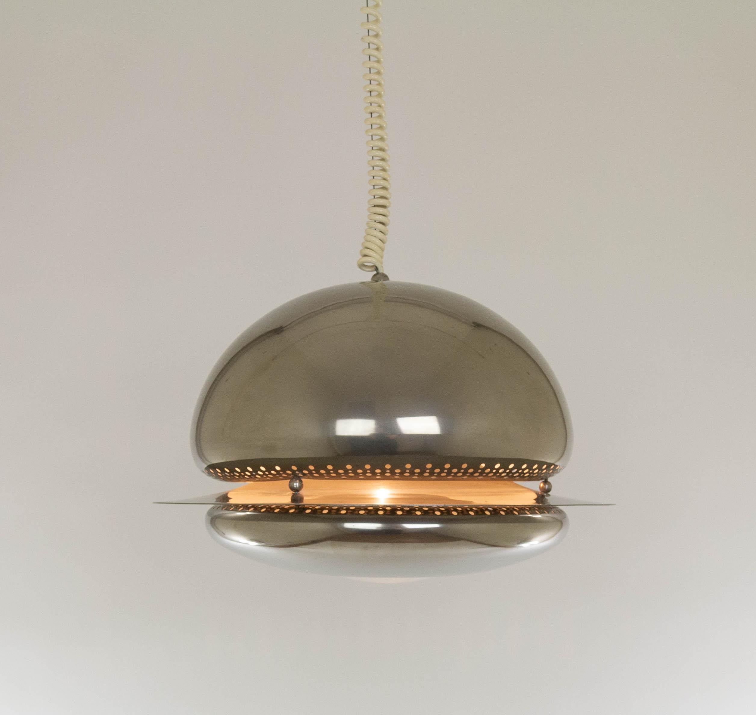 Nickel-plated Nictea pendant designed by Tobia and Afra Scarpa for Italian Lighting manufacturer Flos in 1963.

In a Flos catalogue from the 1970s we found this description: 