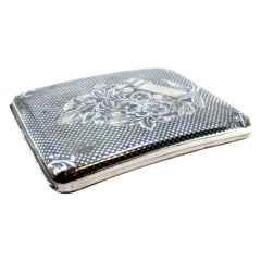 Nickel plated silver cigarette case with flowers and hinged lid