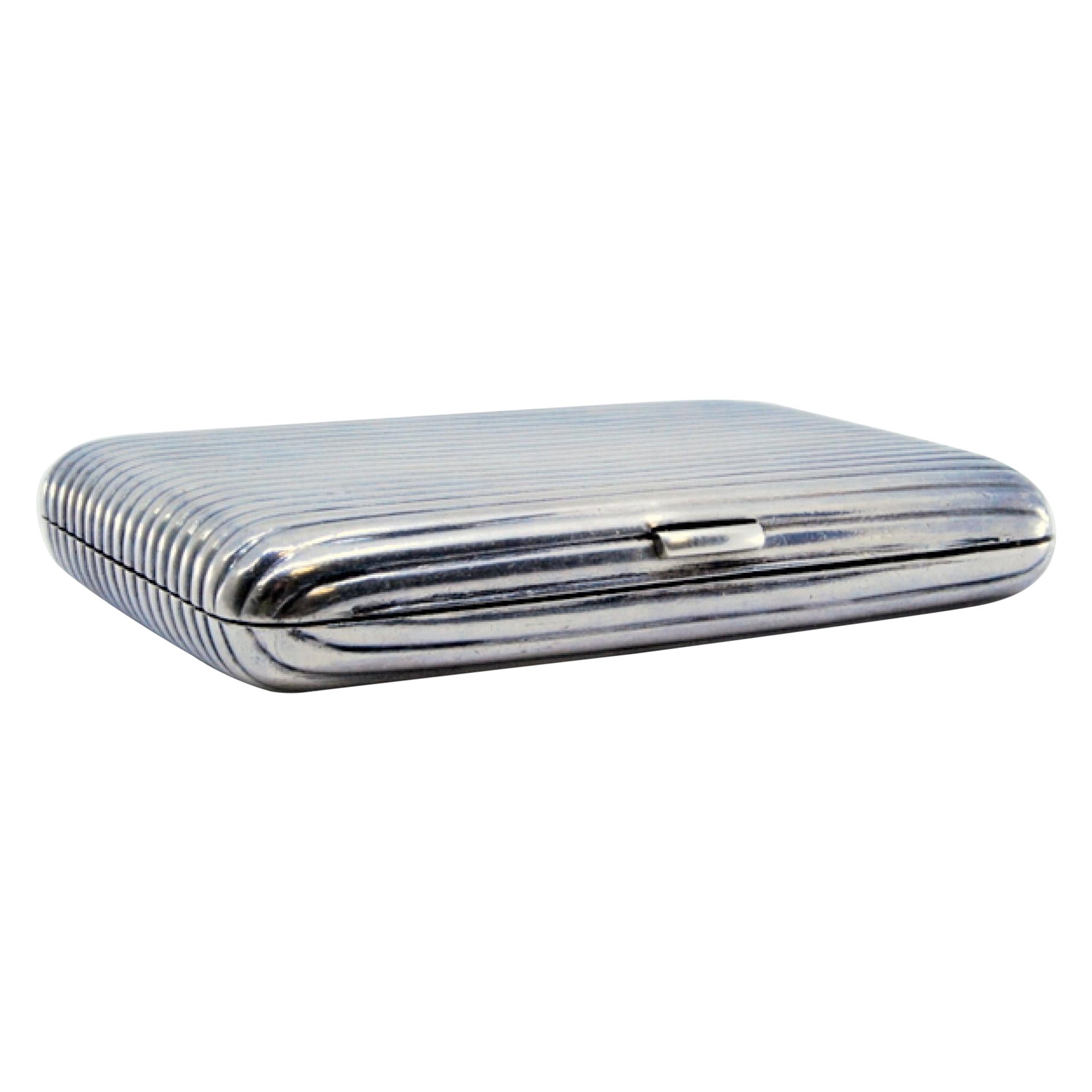 Nickel plated silver cigarette case with fluted bands and hinged lid