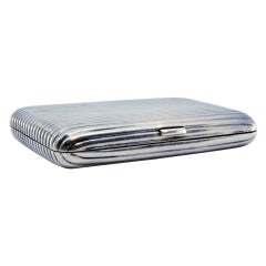 Nickel plated silver cigarette case with fluted bands and hinged lid