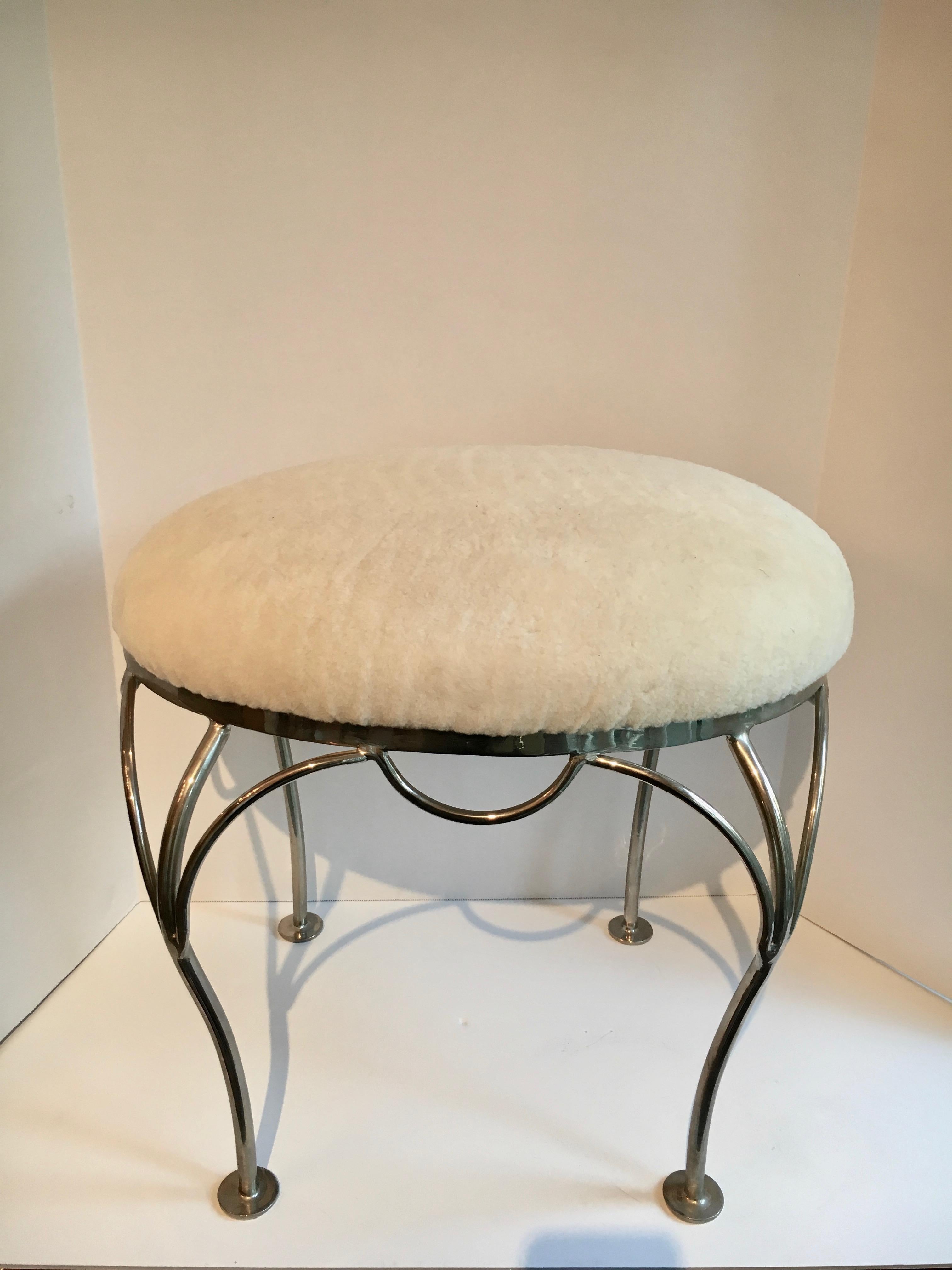 Nickel-plated vanity stool with shearling seat, simple and elegant. A great addition to any vanity or bedroom.