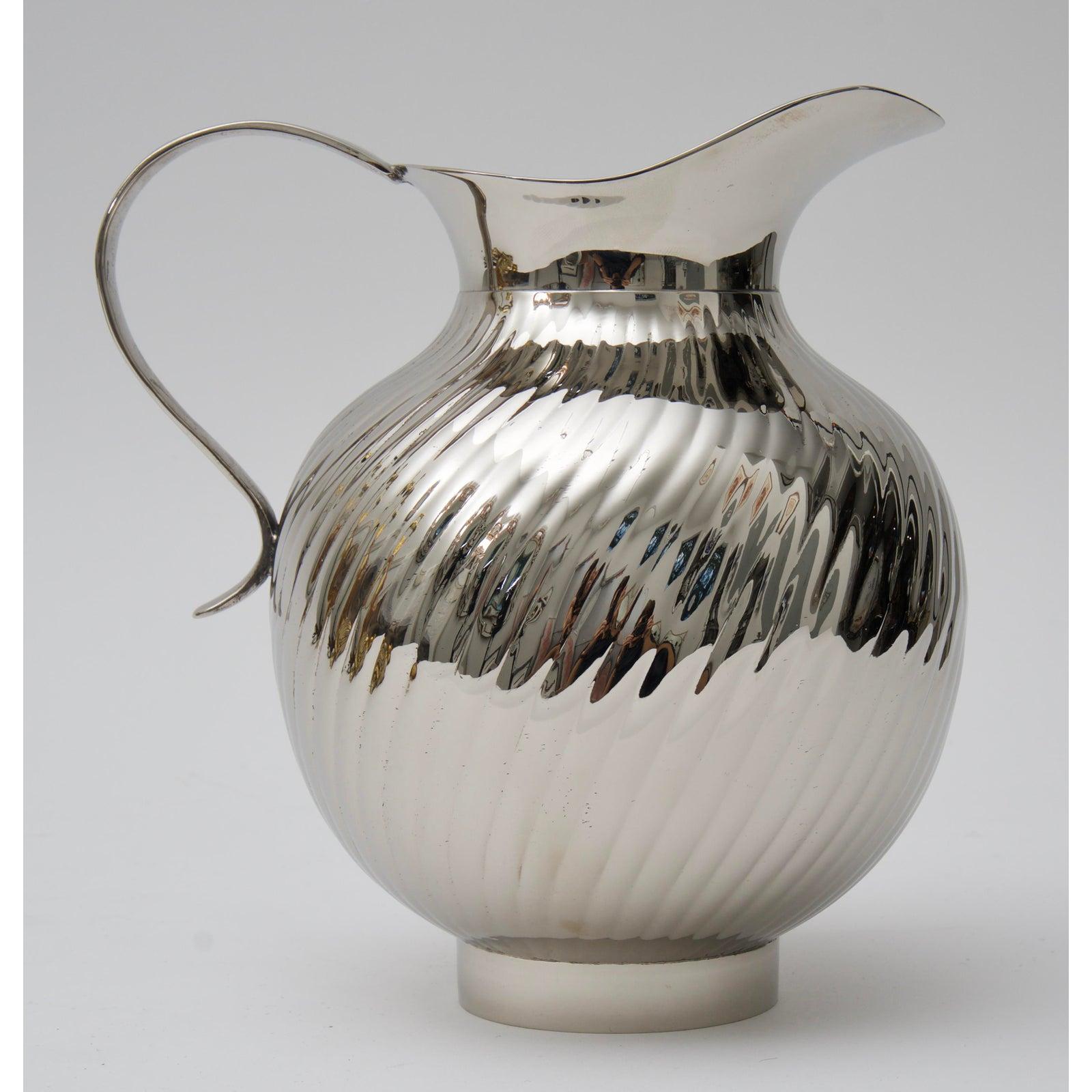 This stylish nickel-plated water pitcher will make a great addition to your barware collection and of course for your next holiday gathering.

Note: This piece has a great weight to it of 2.55 lbs.