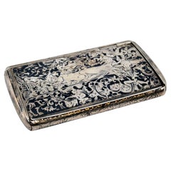 Nickel-silver snuff box with engraved paradise scene and gold interior