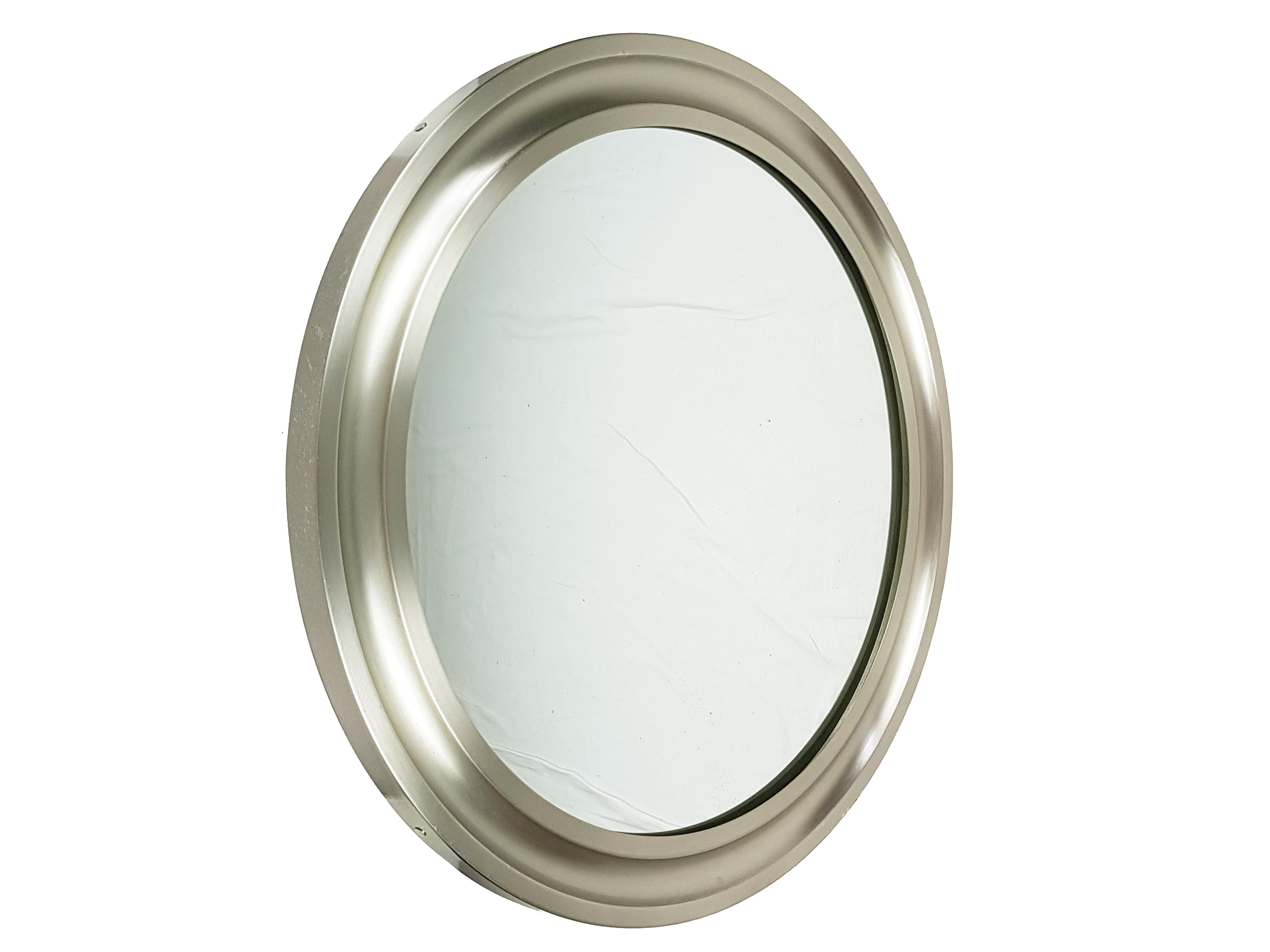This wall mirrors are made from a nickel-plated brass circular frame with brushed finishing and a black metal back. thery remain in very good condition.