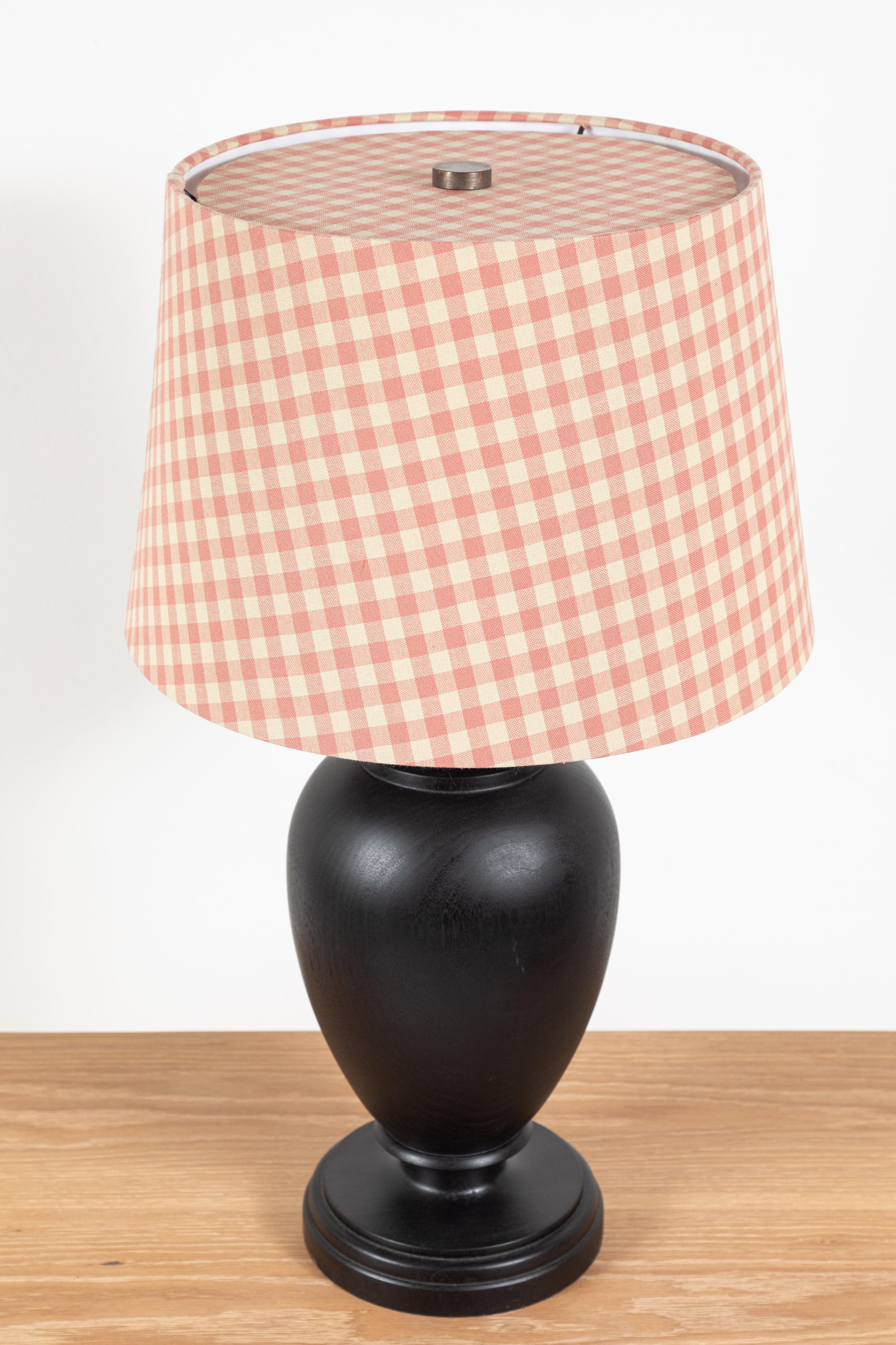 Nickey Kehoe Collection black stained urn table lamp with custom pink plaid shade. The wooden base is intricately hand turned and stained in Los Angeles. The lamp base measures: 7