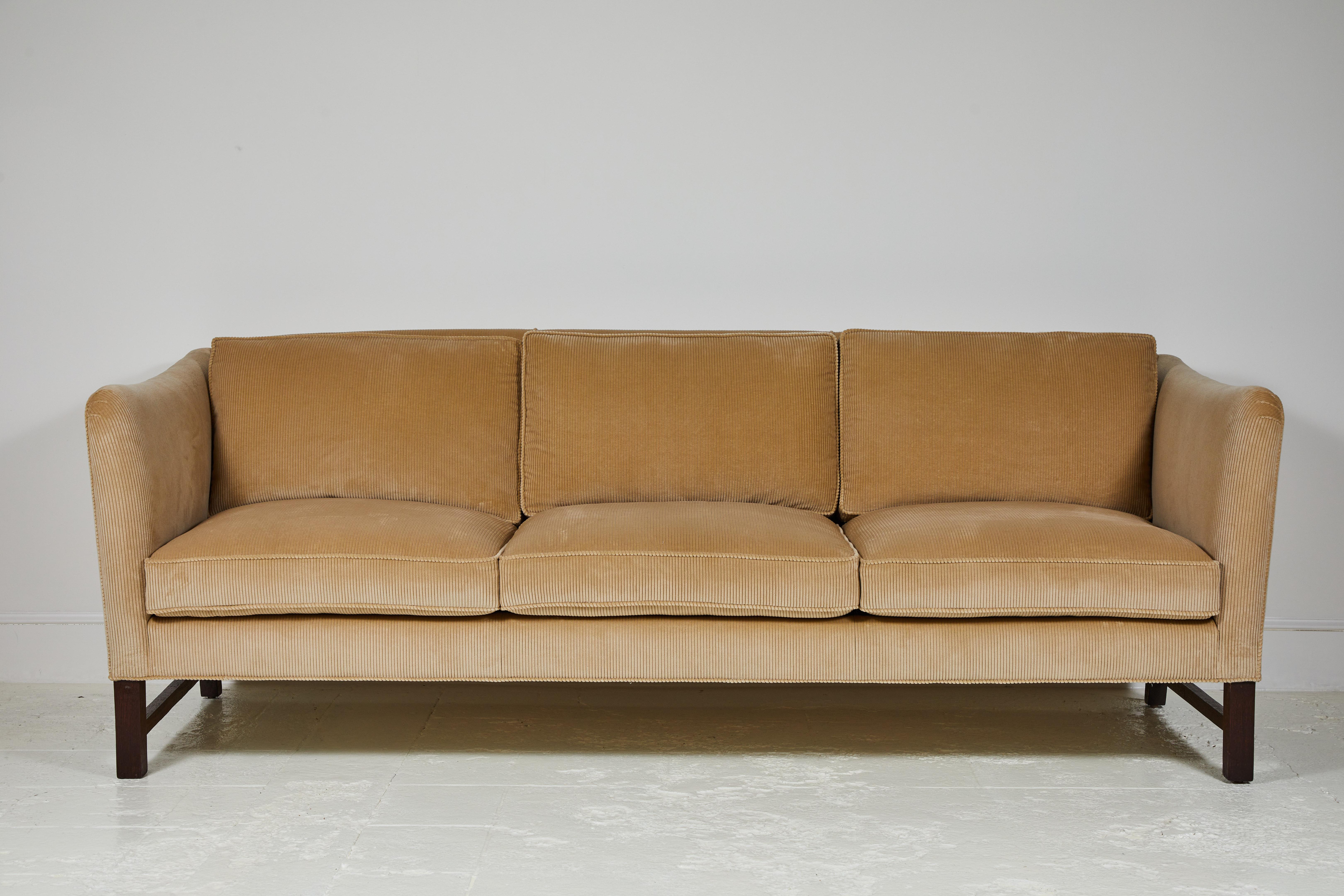 Nickey Kehoe Collection high arm sofa offers elegant Scandinavian lines with Classic sloped arms. With Loose seat and back cushions. The wood exposed base can be specified in oak.

This specific sofa is upholstered in Jab Corduroy.