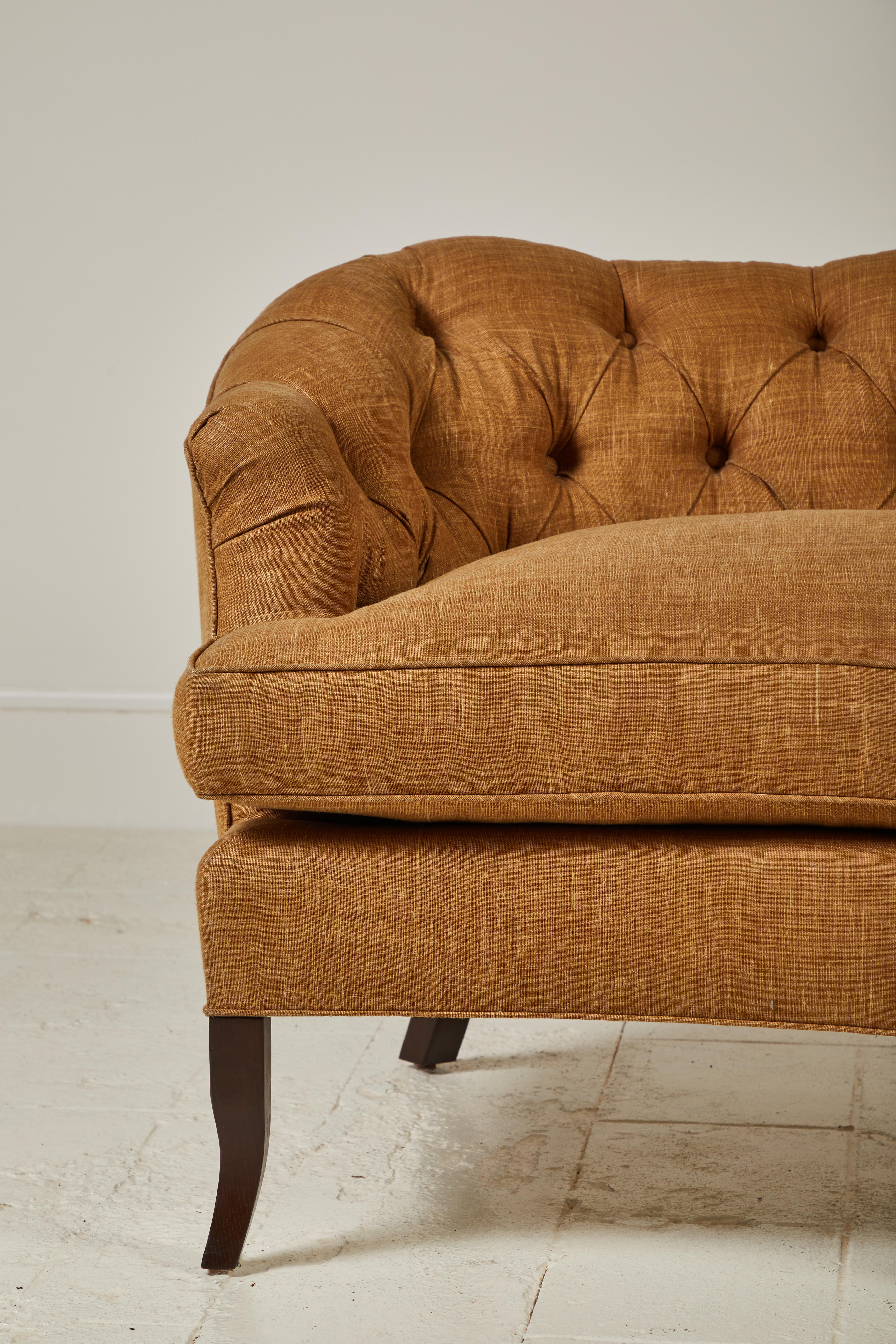 Deep tufting adds a slight masculine note to our classic camelback silhouette. Curved back and legs offer elegance, levity, and a well-proportioned finish to the sofa. Seat is removable and includes built-in cushion clips.