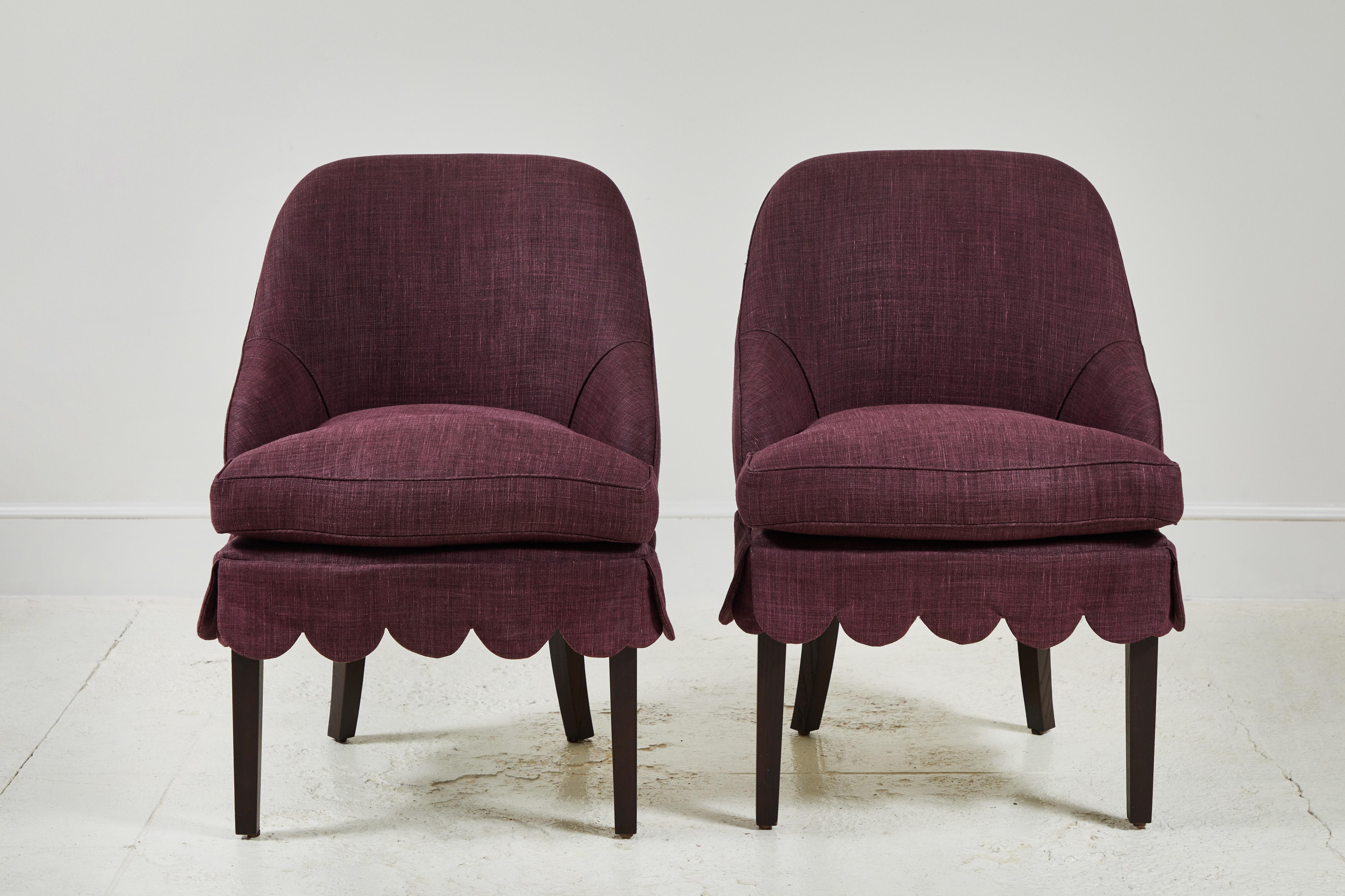 Our simplified expression of a Classic Napoleon III slipper chair finished with a sweet scallop-edged skirt. Carefully considered lumber pitch for table-side seating comfort. Seat cushion featuring down and feather crown for flexible use on both
