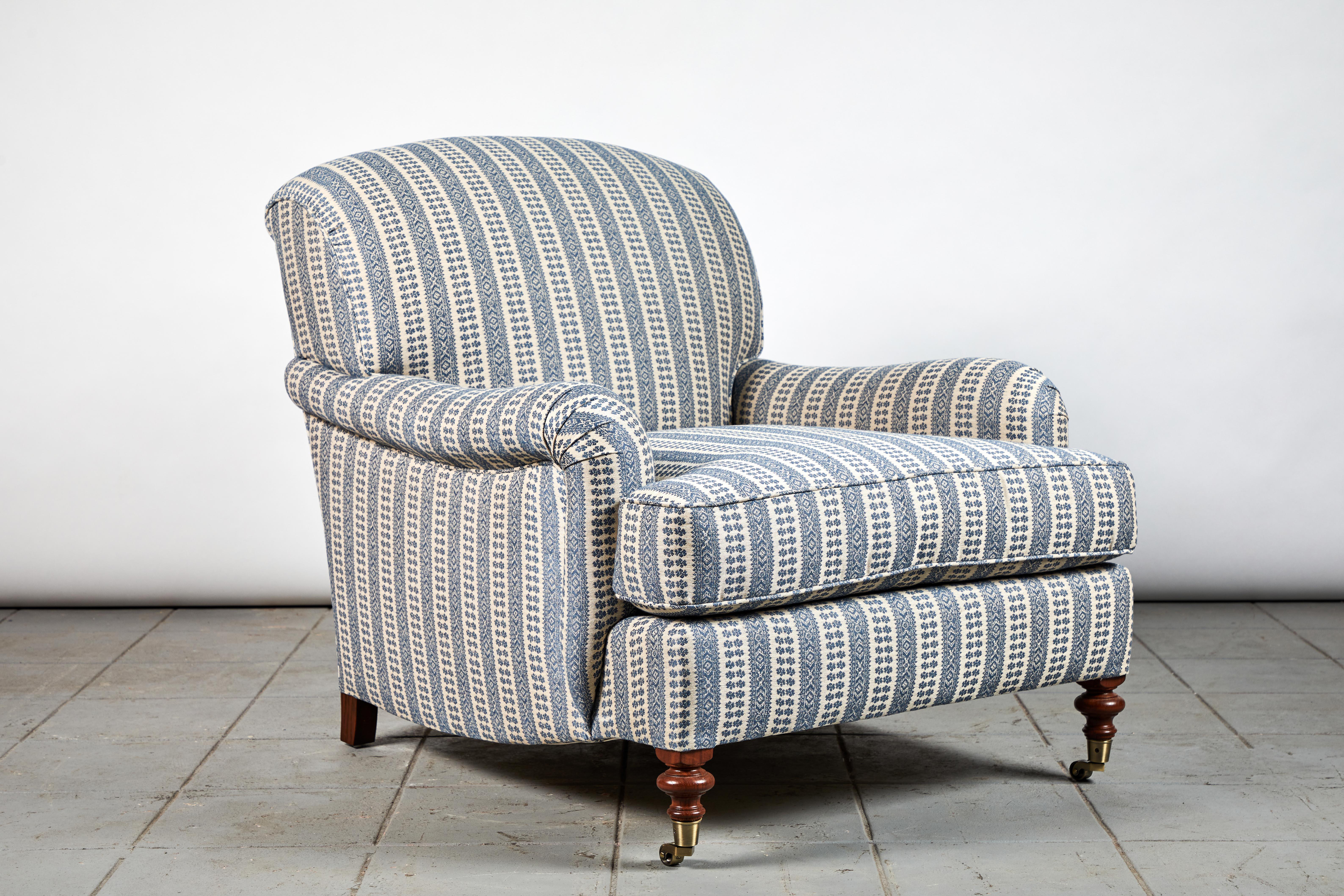 Light a fire, grab your favorite book, curl up in the English roll armchair, and prepare for the coziest rainy day on record.

This English roll armchair is beautifully upholstered in a Susan Deliss Fabric, the legs are finished in oak stained