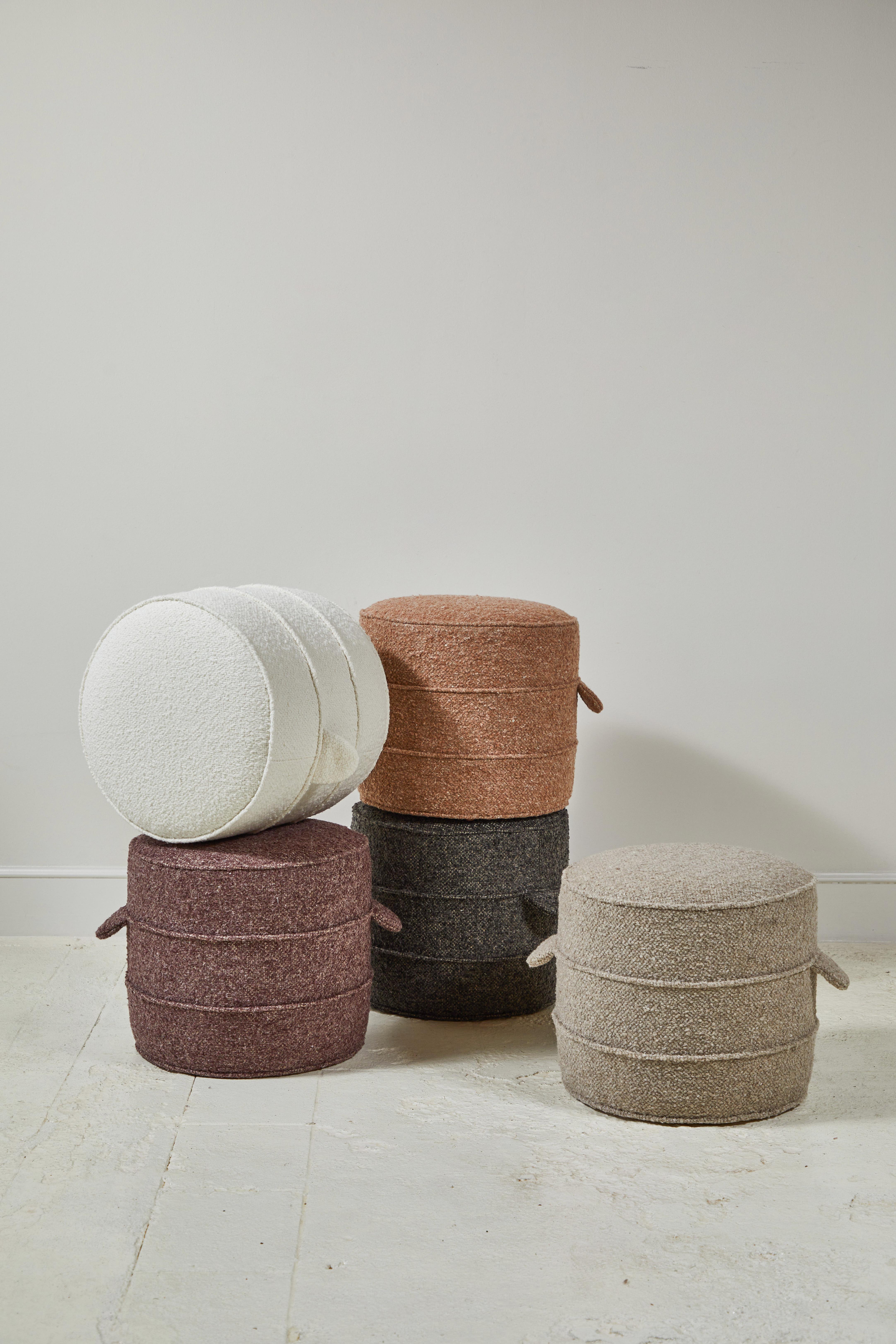 Solid wood frame and upholstered hassock with two ring piping and double handle details offers versatility in accent seating. These hassocks are available in the selected boucle colors.