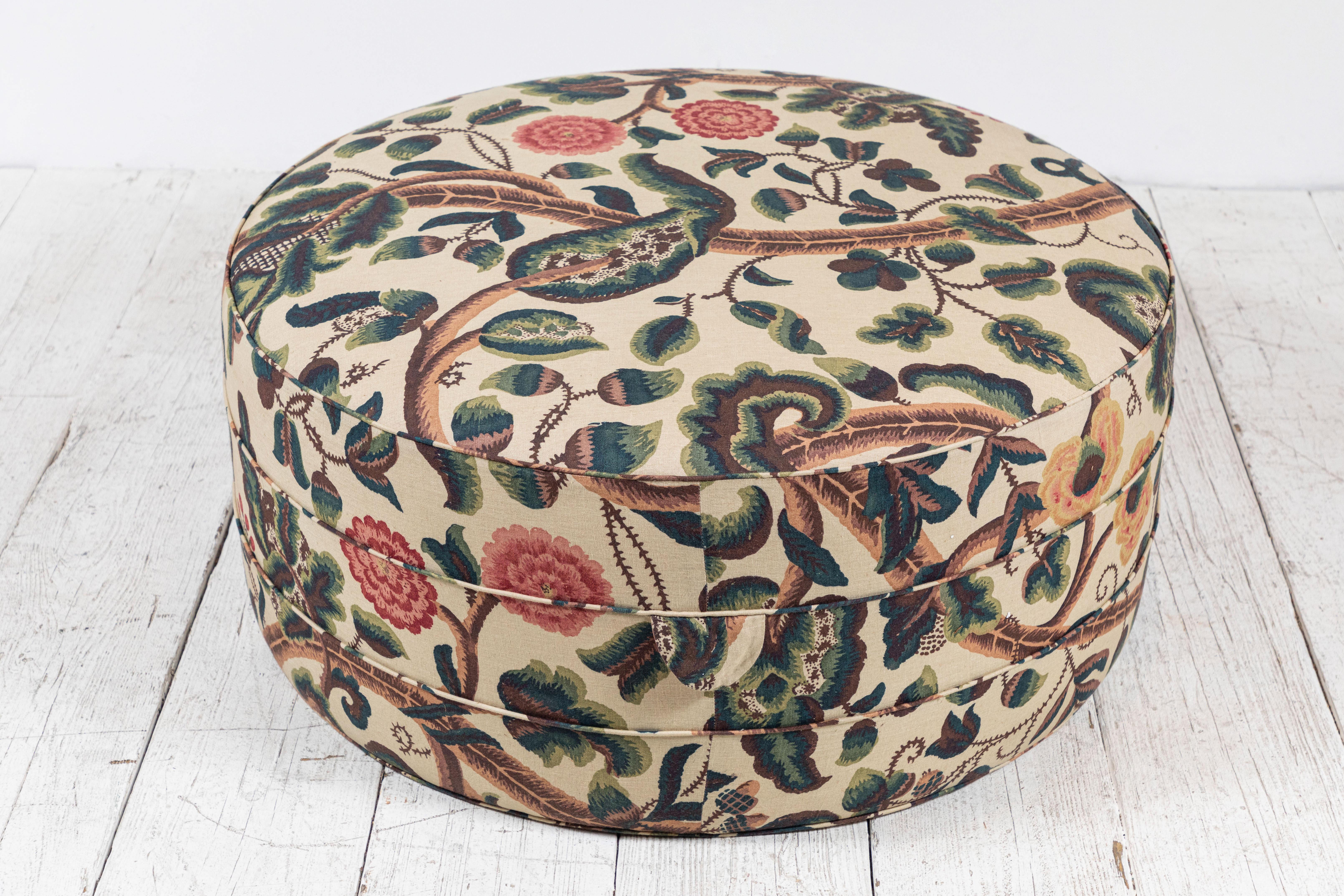Solid wood frame and upholstered hassock with two ring piping and double handle details offers versatility in accent seating. 

This large out ottoman is upholstered in Claremont Tree of Life Fabric.