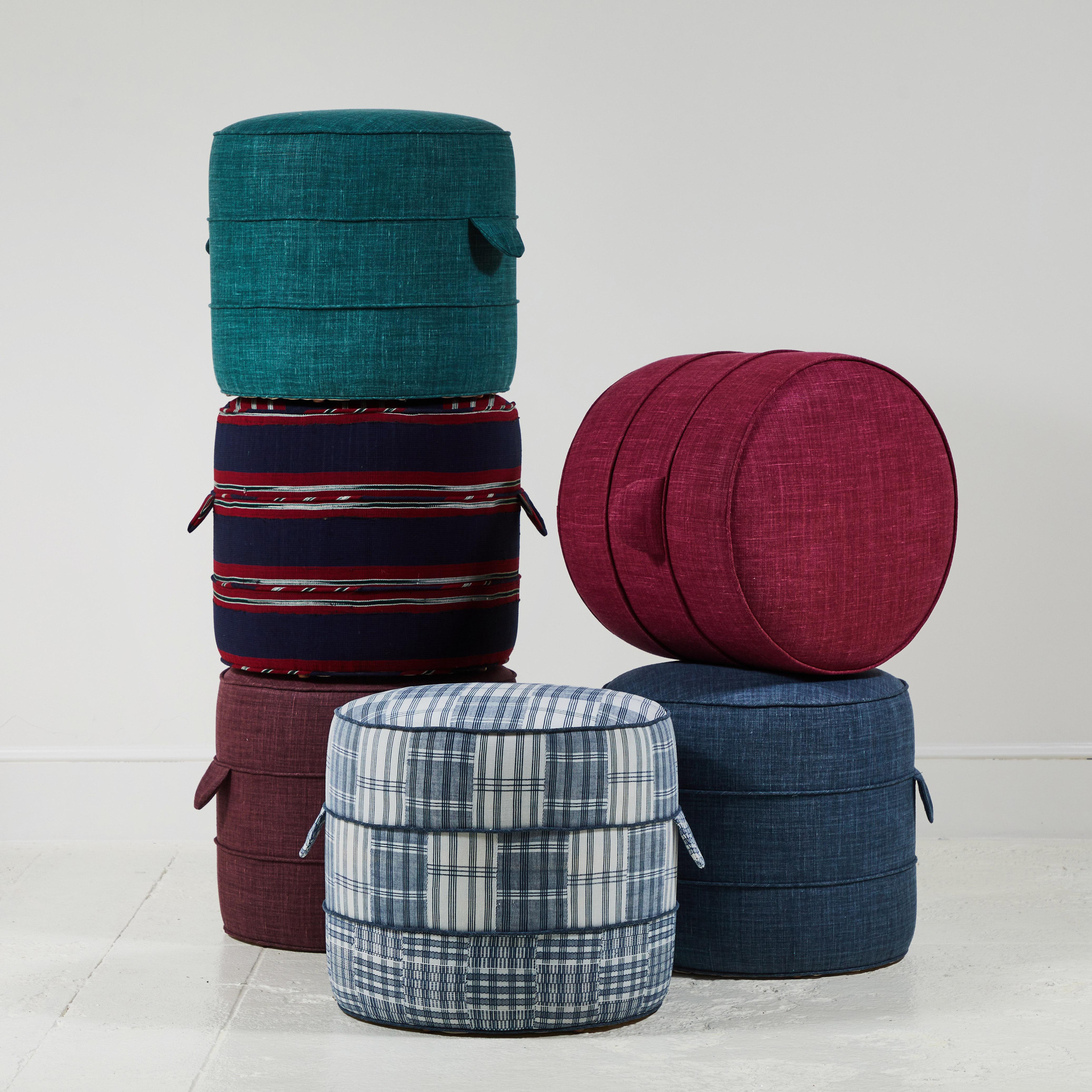 Solid wood frame and upholstered hassock with two ring piping and double handle details offers versatility in accent seating.

The hassocks photographed are upholstered in Libeco Linen.

The patterned hassocks are made from one of a kind African