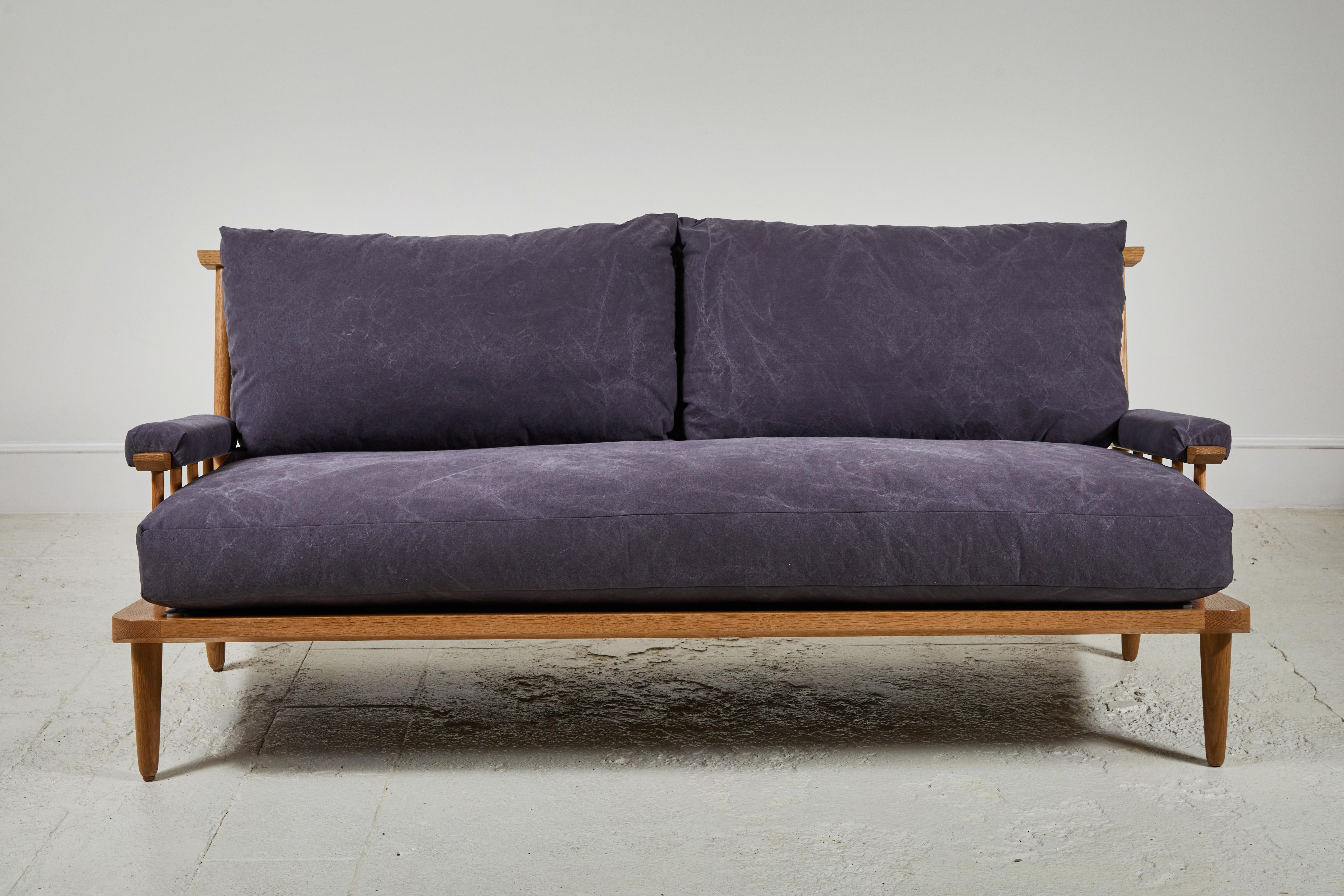 An open silhouette creates a lightweight feeling revealing expert craftsmanship and sophisticated design. Gentle back pitch cushioned by down and feather wrapped high density foam core cushions offer deep repose and generosity for lounging. This