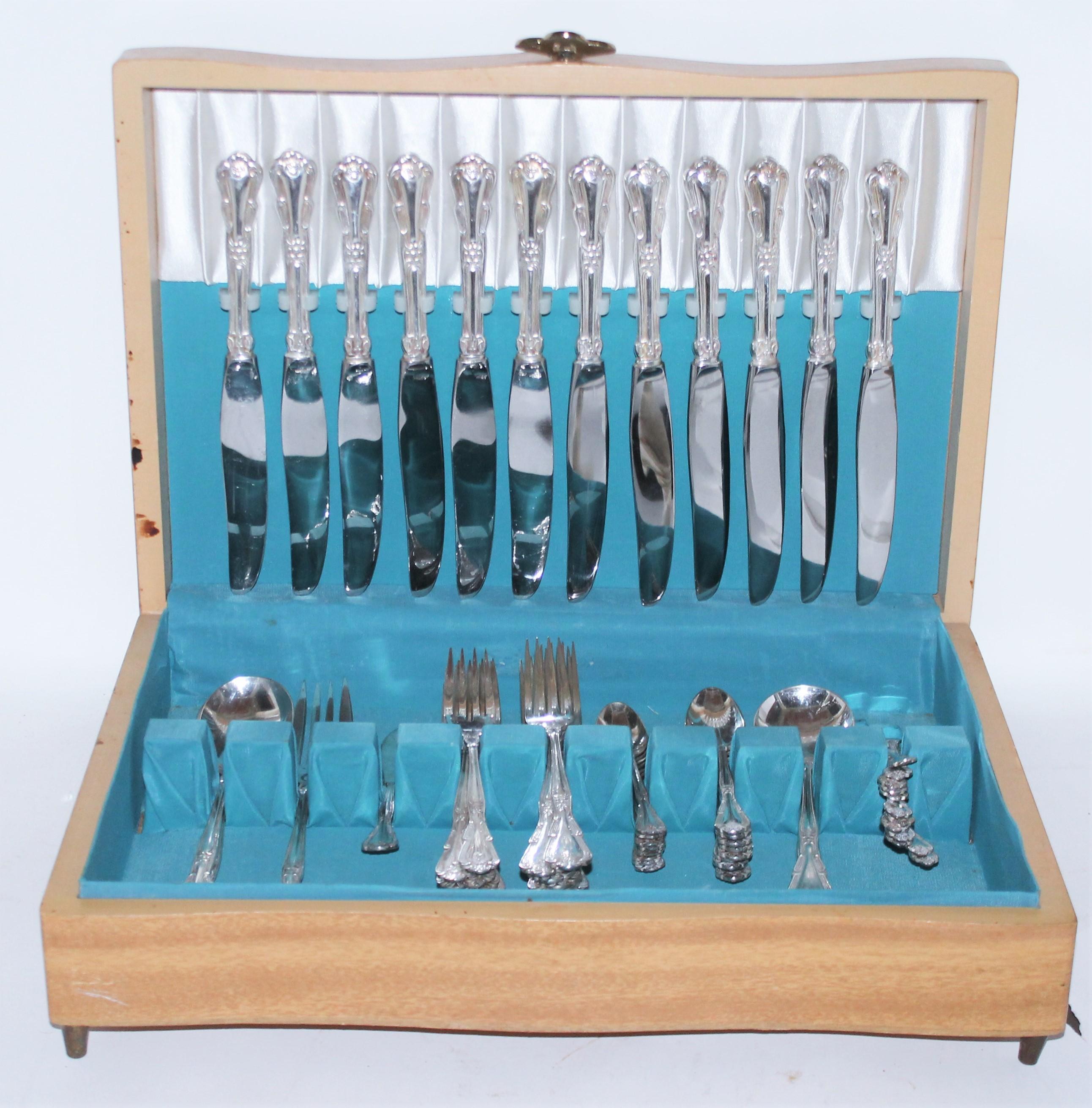 Serving for 12 nickle silver. 60 pcs set with original maple wood silver storage box. Lovely Aqua green/mint interior.