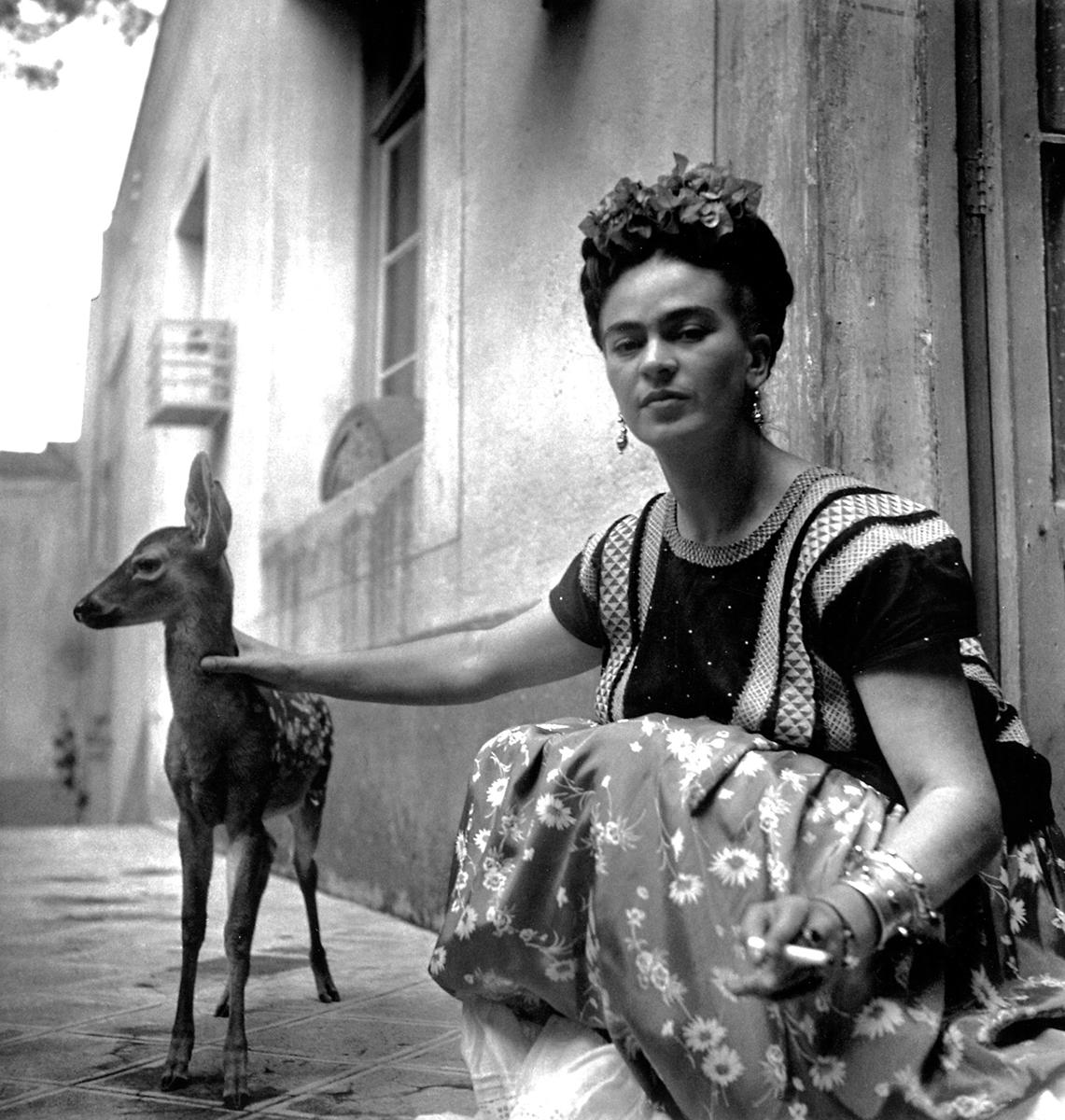 Frida with Granizo by Nickolas Muray is a black and white portrait of Mexican surrealist painter Frida Kahlo with her pet fawn, Granizo. 

Platinum Print
Image size: 11 x 10.5 in.
Paper size: 20 x 16 in.
Edition 21/30
Titled, dated, artist name,
