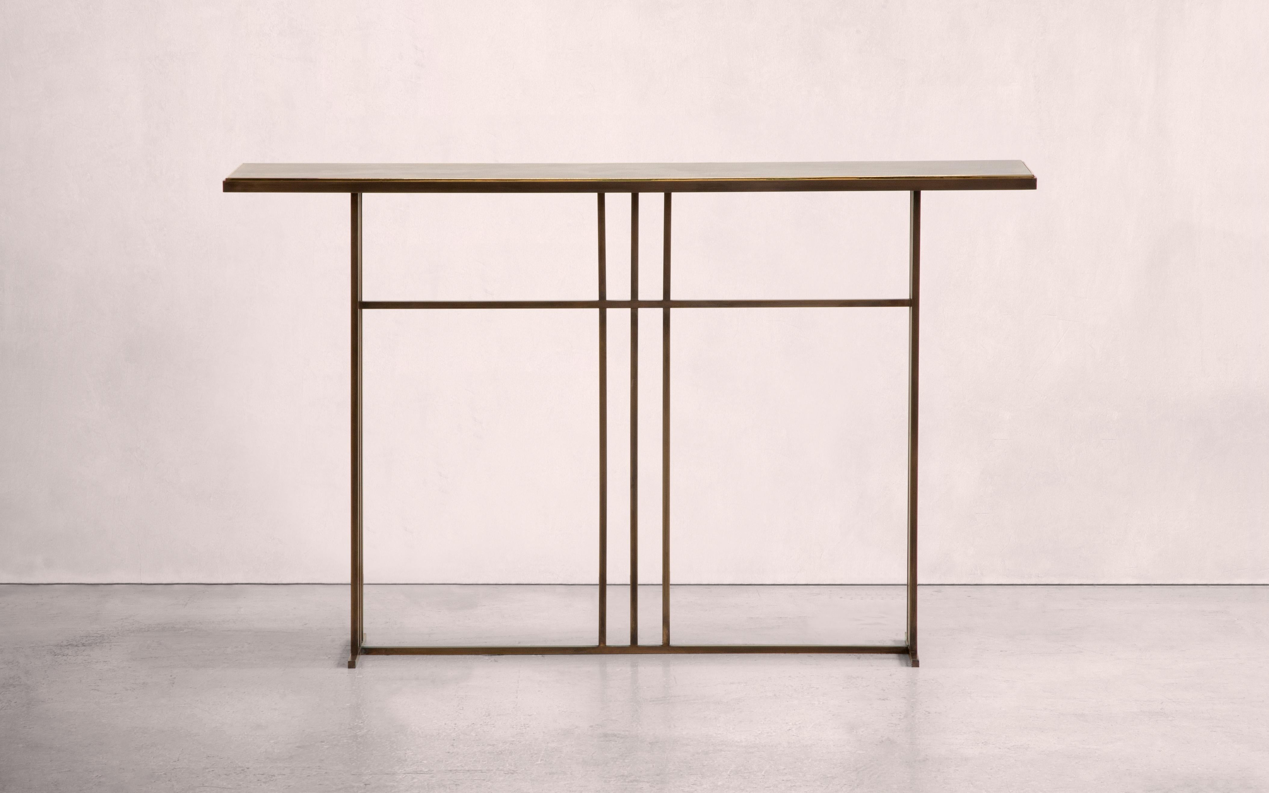 A console table in patinated brass, with a polished brass trim. Hand crafted in the North to order. Custom sizes and finishes are available.

Measures: 150 W x 30 D x 80cm H. 
Custom sizes available.

Made to order in 12 weeks.
Price excludes VAT.