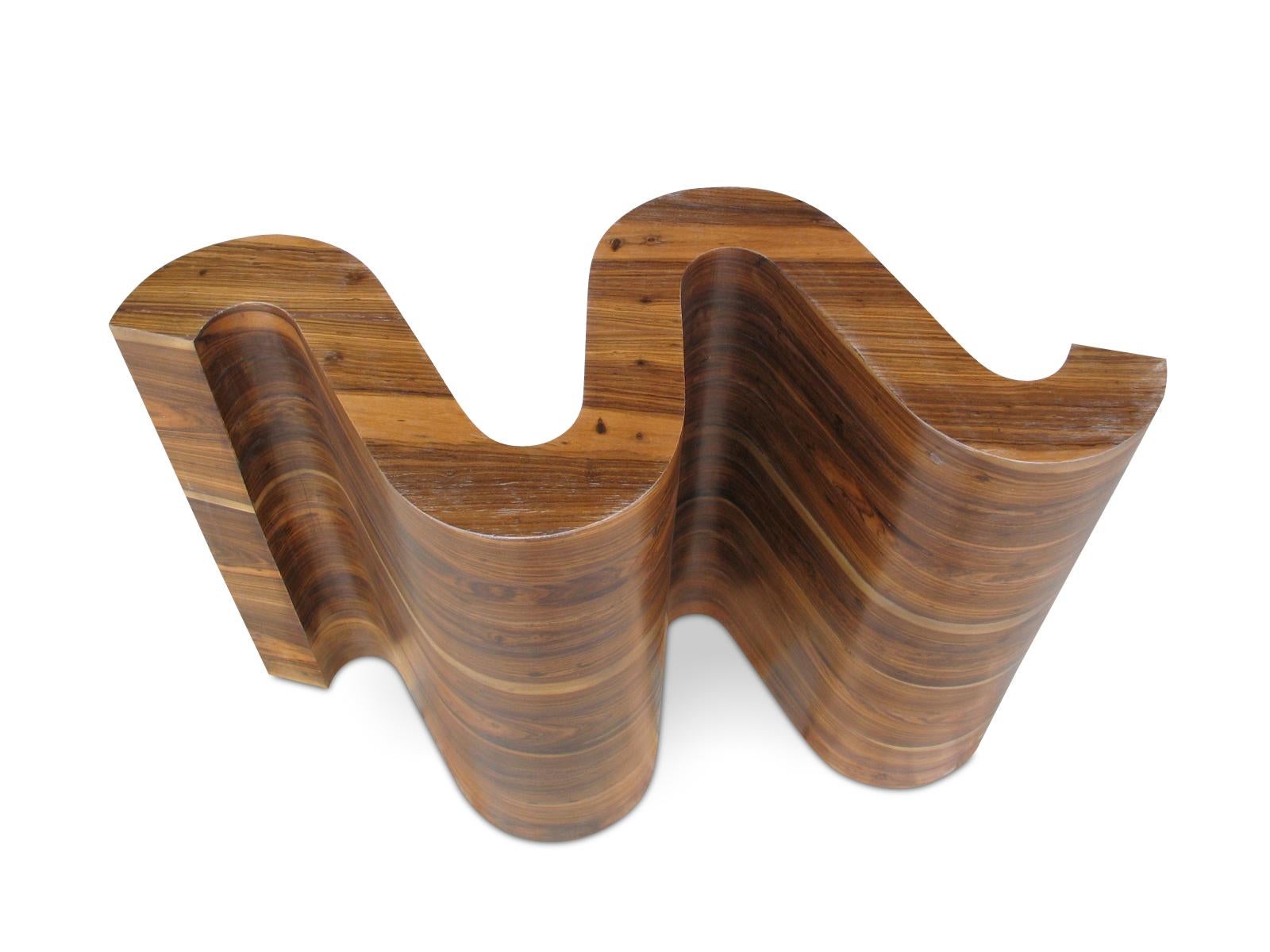 The Nico is a decorative and functional object that can be made in any species of wood and/or lacquered for your desired finish.  Shown in Argentine Rosewood, this piece is customizable and can be used with any size top or as is.  