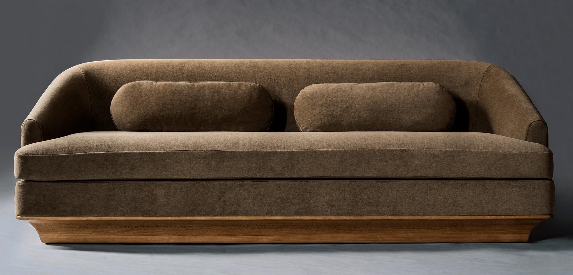 The Nico Sofa combines handsome proportions with timeless materials and an emphasis on comfort. Straight lines are tempered by curved edges and sloping arms, resulting in a thoughtful balance of hard and soft elements. Subtle decorative accents,
