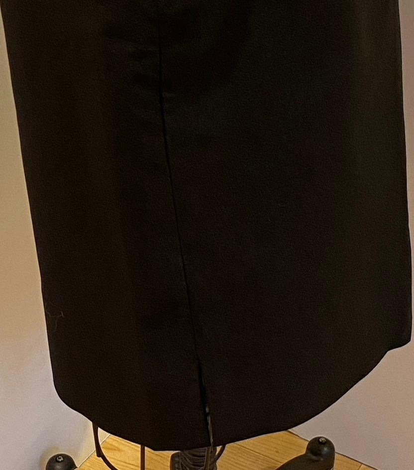    Nicol Caramel from Italy's wonderfully elegant and rich medium-weight black spandex-blend pencil skirt has a length of 27 inches. The waist measures 29 inches, and hips are 38 inches. Please note: measurements are taken aat 