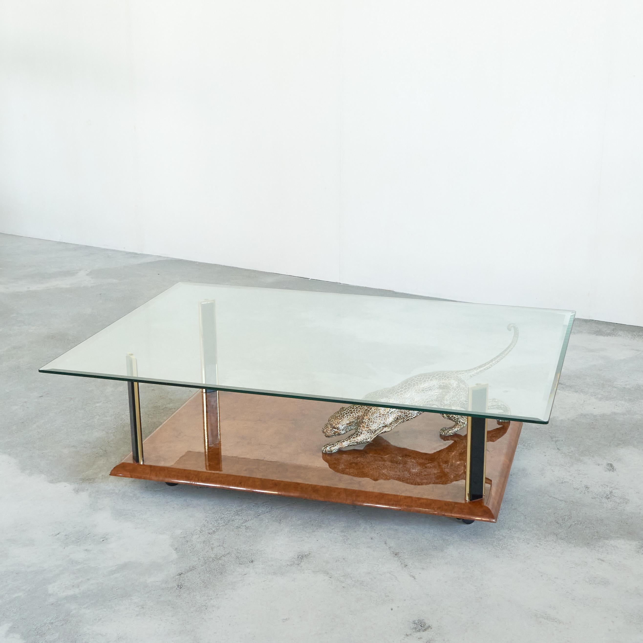 Nicola Voci 'Jaguar' Coffee Table in Bronze, Burl Wood and Beveled Glass 1970s.

This is a spectacular and high-end coffee table by artist Nicola Voci, made from lacquered burl wood, patinated bronze, brass and beveled glass. It shows a leaping