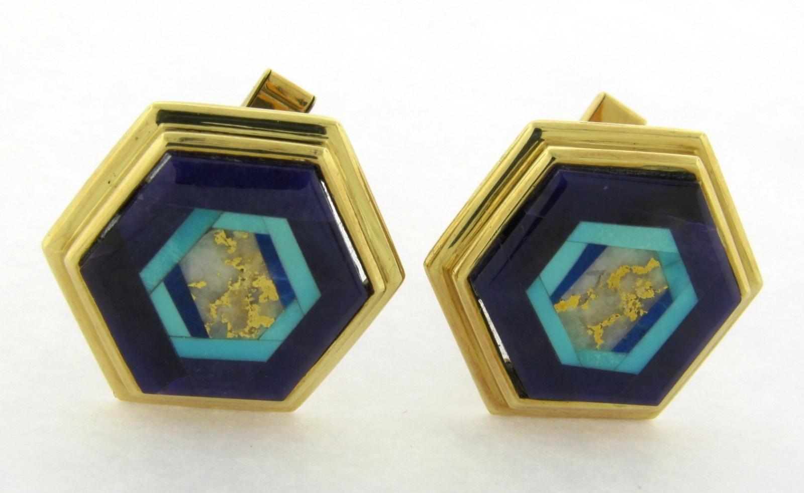 This is a beautiful and rare pair of Gemstone cufflinks by famous intarsia designer Nicolai Medvedev. The gemstones consist of sugilite, turquoise, lapis lazuli and gold quartz. They are signed N. Medvedev on the stone the gold is marked 18k