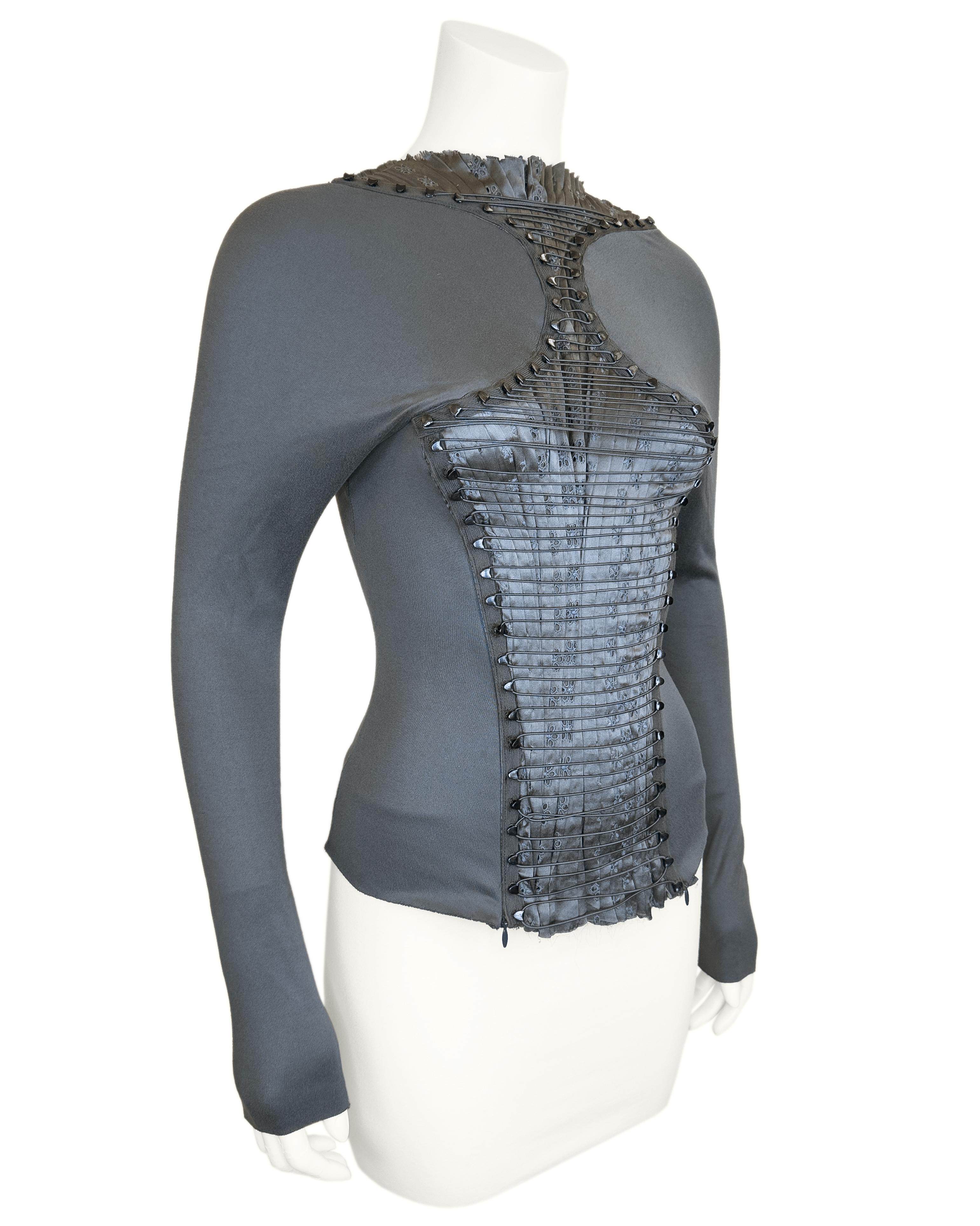 Very rare pewter green Nicolas Ghesquiere for Balenciaga deconstructed top with pleated broderie anglaise and corseted lace -up front. Stretchy material for a body conturing fit.  
From the fall 2001 collection. 
Size 36, fits US size 2-4. 
Unlined.