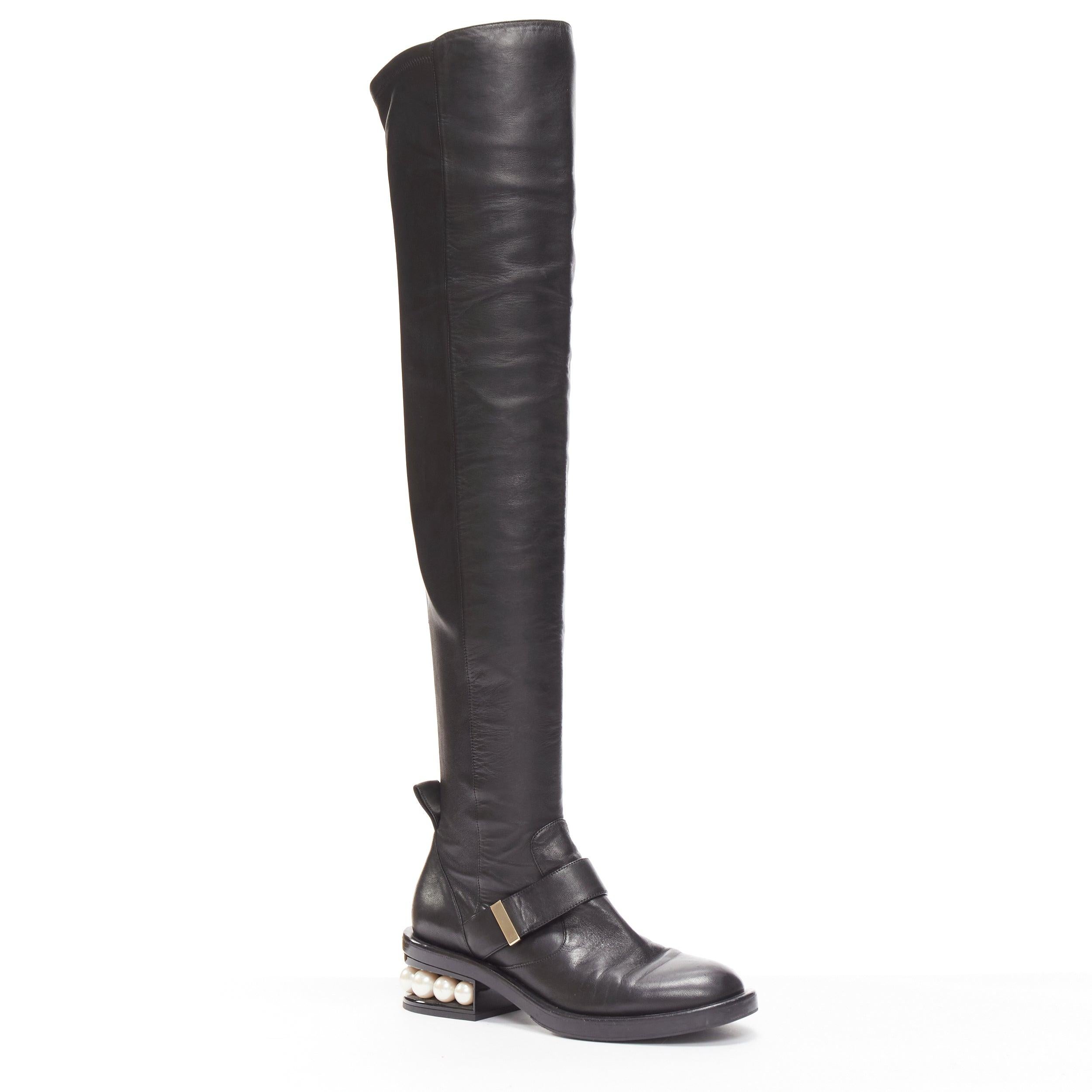 NICOLAS KIRKWOOD black XL pearl embellished heel knee high flat boots EU37.5
Reference: NKLL/A00095
Brand: Nicholas Kirkwood
Material: Leather
Color: Black, Pearl
Pattern: Solid
Closure: Stretchy
Extra Details: Black soft leather stretch fit.