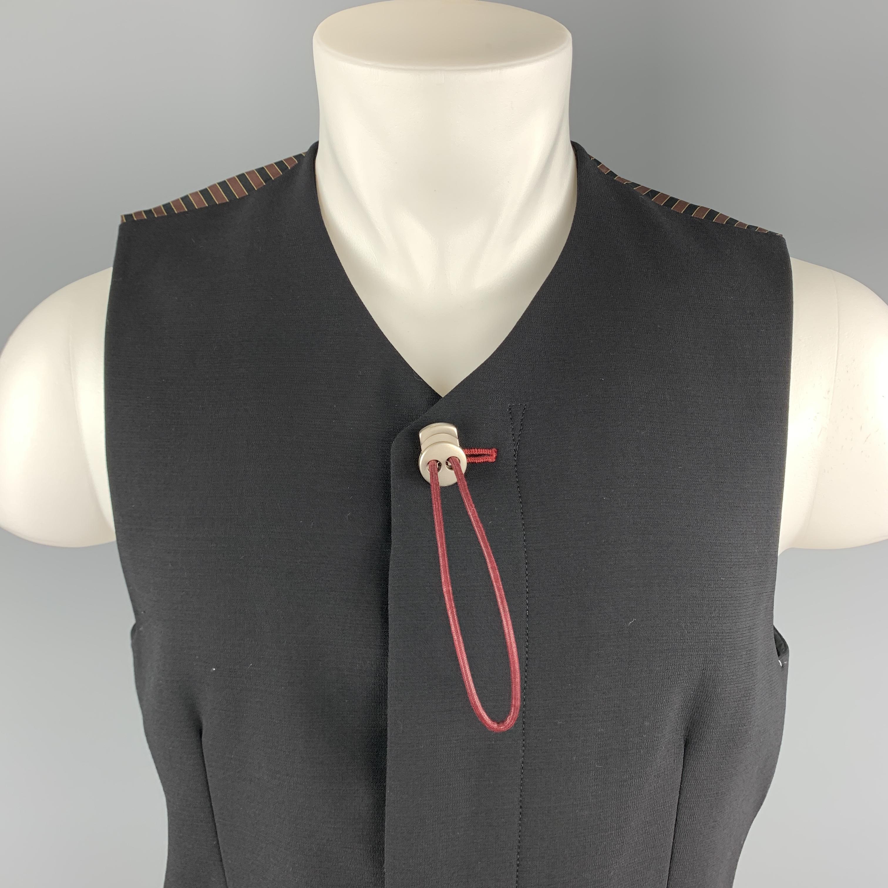 NICOLE BLUB FOR MEN by MATSUDA vest comes in a black crepe featuring a adjustable string button detail, slit pockets, plaid print back, back belt, and a hidden button closure.

Very Good Pre-Owned Condition.
Marked: M

Measurements:

Shoulder: 14